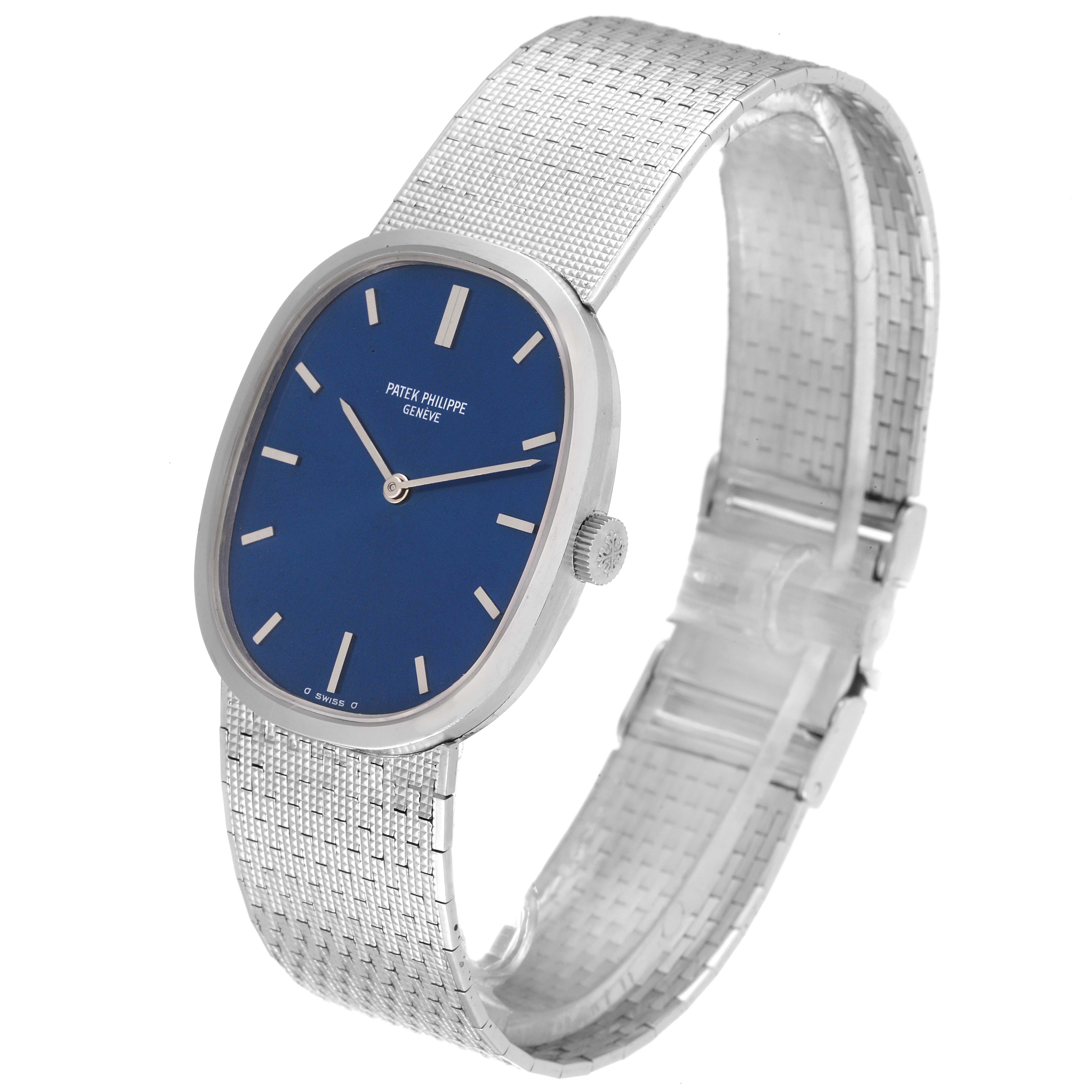The image shows a Patek Philippe Golden Ellipse 3548 Women's White Gold Blue Dial 3548 Women's White Gold Blue Dial watch from a three-quarter profile, highlighting its blue dial and metal band.