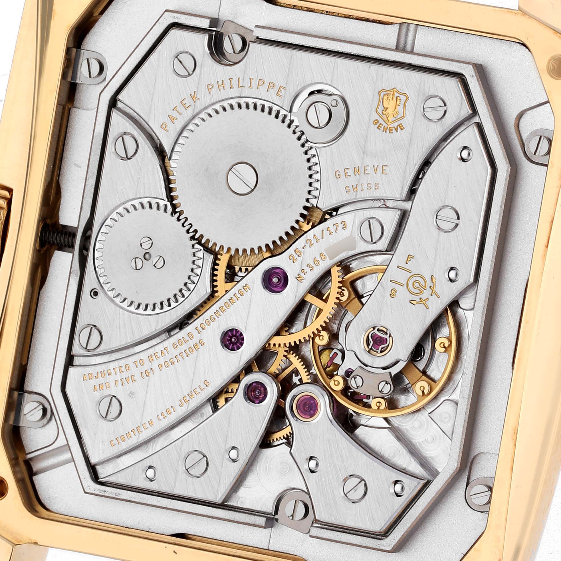 The image shows the intricate movement of a Patek Philippe Gondolo 5124J Men's Yellow Gold Silver Dial 5124J Men's Yellow Gold Silver Dial watch, highlighting gears and engravings from a top view.