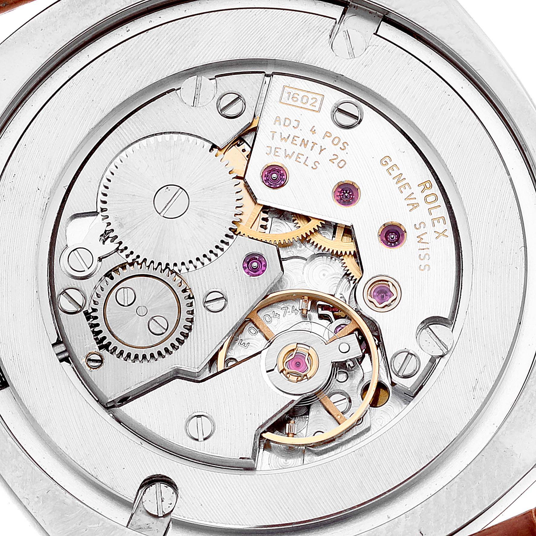 The image shows the internal movement mechanism of the Rolex Cellini 4233 Men's Steel and Gold (two tone) Black Dial 4233 Men's Steel and Gold (two tone) Black Dial watch from a top-down angle, highlighting gears and jewels.