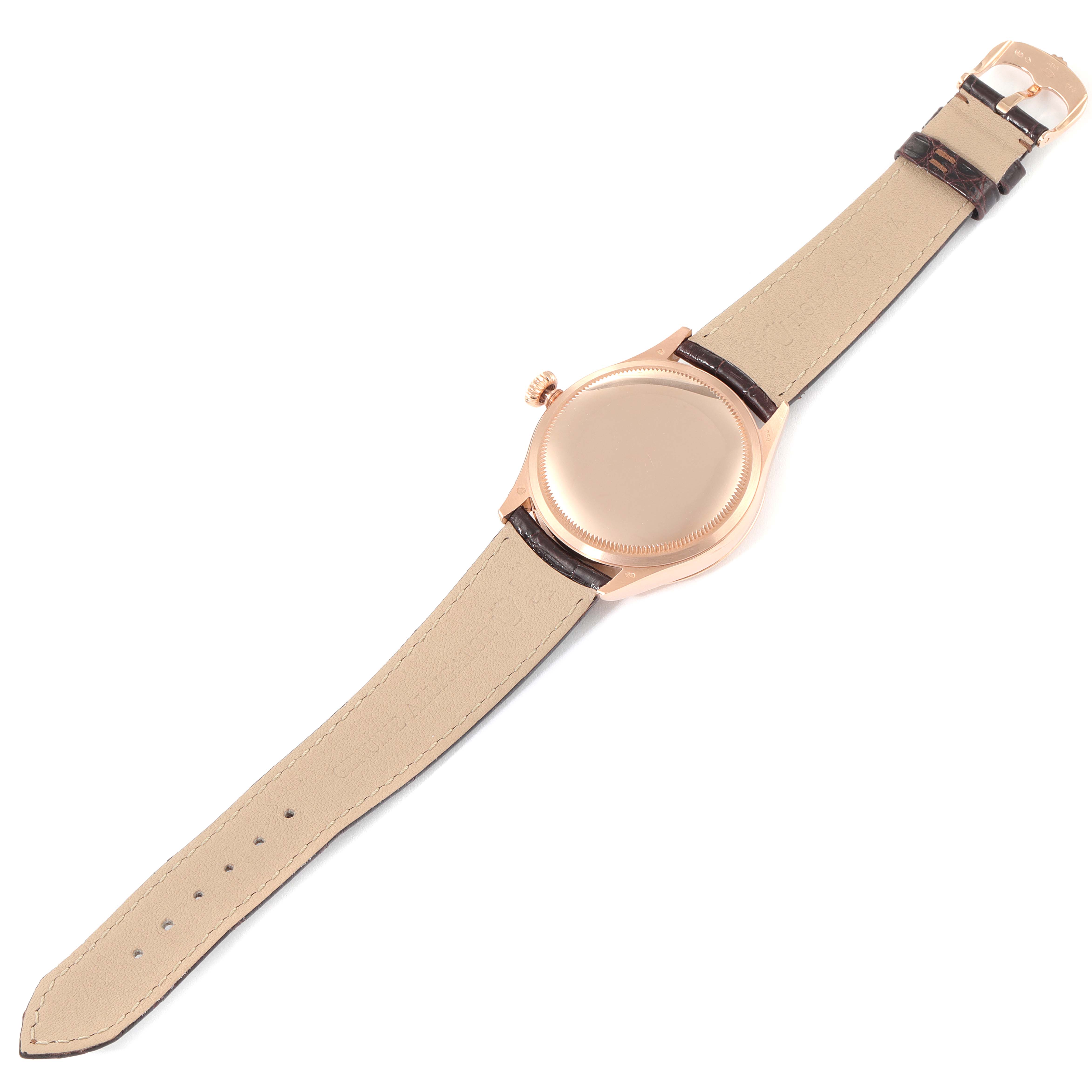 This image shows the back of a Rolex Cellini 50505 Men's Rose Gold Pink Dial 50505 Men's Rose Gold Pink Dial watch, highlighting its beige leather strap and rose gold case.
