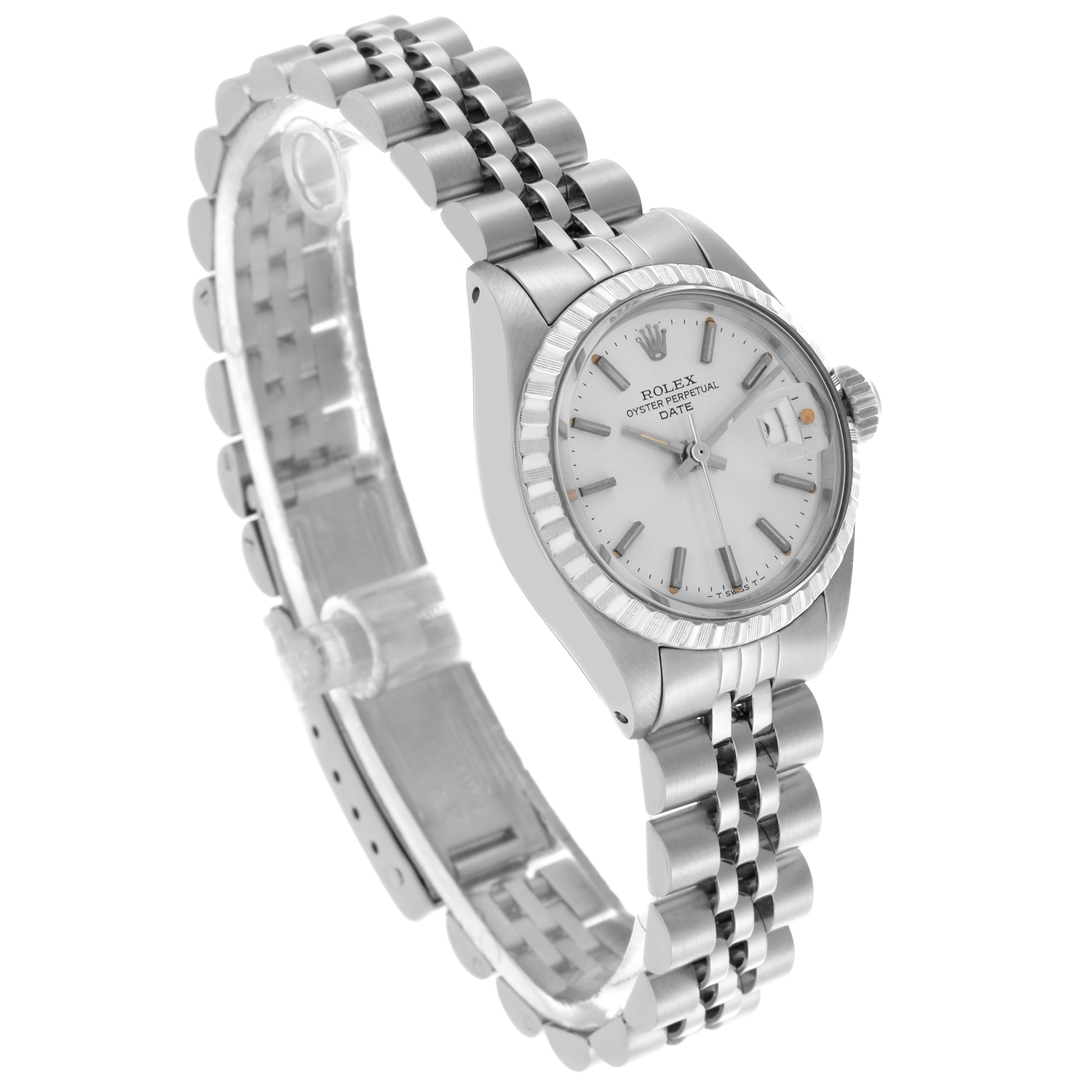 The Rolex Date 6924 Women's Stainless Steel Silver Dial 6924 Women's Stainless Steel Silver Dial watch is shown at an angled side view, highlighting the watch face, bezel, and bracelet.