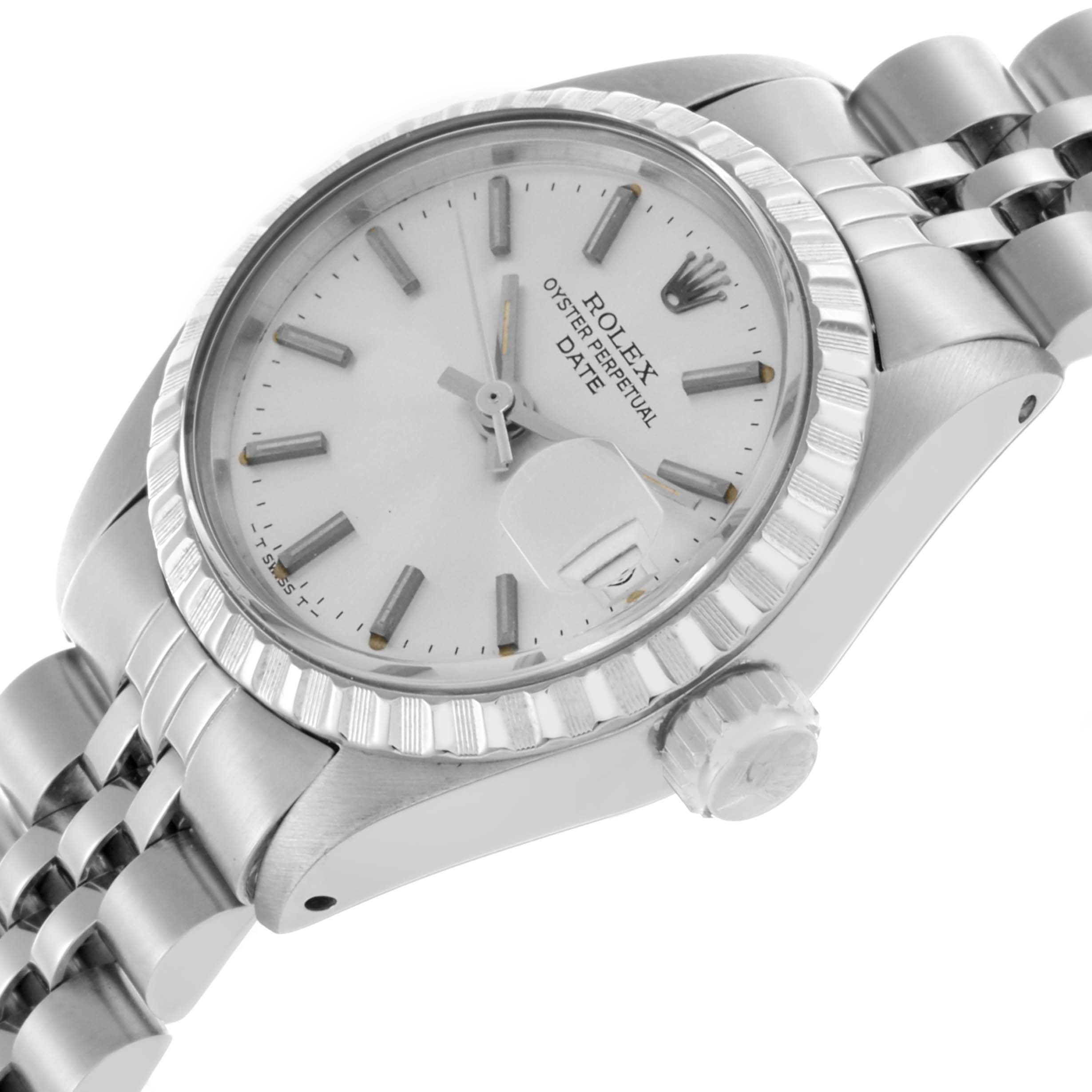 The Rolex Date 6924 Women's Stainless Steel Silver Dial 6924 Women's Stainless Steel Silver Dial watch is shown at a slight angle, highlighting its dial, bezel, crown, and bracelet.