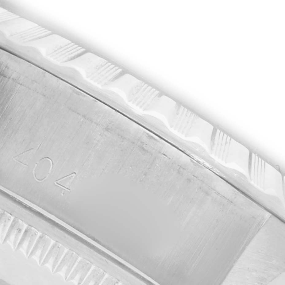 The image shows a close-up of the bezel and part of the edge of the case for the Rolex Date 6924 Women's Stainless Steel Silver Dial 6924 Women's Stainless Steel Silver Dial model.