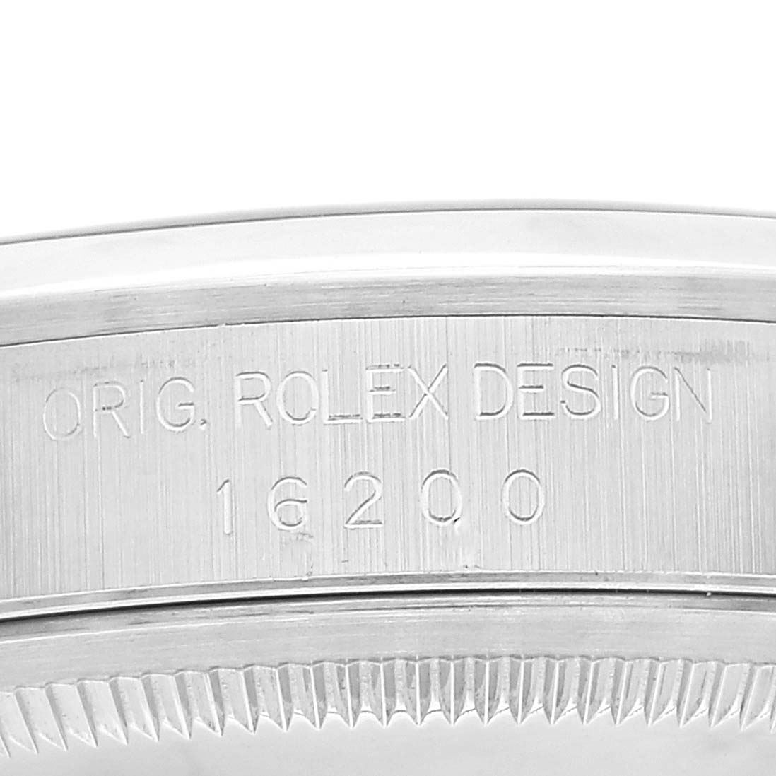 This image shows an angled close-up of the side of a Rolex Datejust 16200 Men's Stainless Steel Blue Dial 16200 Men's Stainless Steel Blue Dial watch case, displaying "ORIG. ROLEX DESIGN 16200".