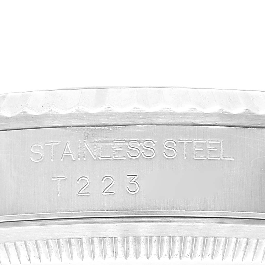 The image shows a close-up of the side of the case of a Rolex Datejust 16234 Men's Stainless Steel Black Dial 16234 Men's Stainless Steel Black Dial, displaying the "Stainless Steel" engraving.