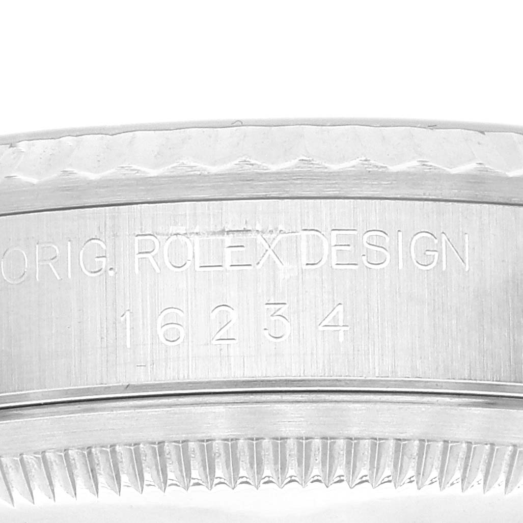 The image shows a close-up view of the case side and bezel of a Rolex Datejust 16234 Men's Stainless Steel Black Dial 16234 Men's Stainless Steel Black Dial watch, highlighting the engraved model number.