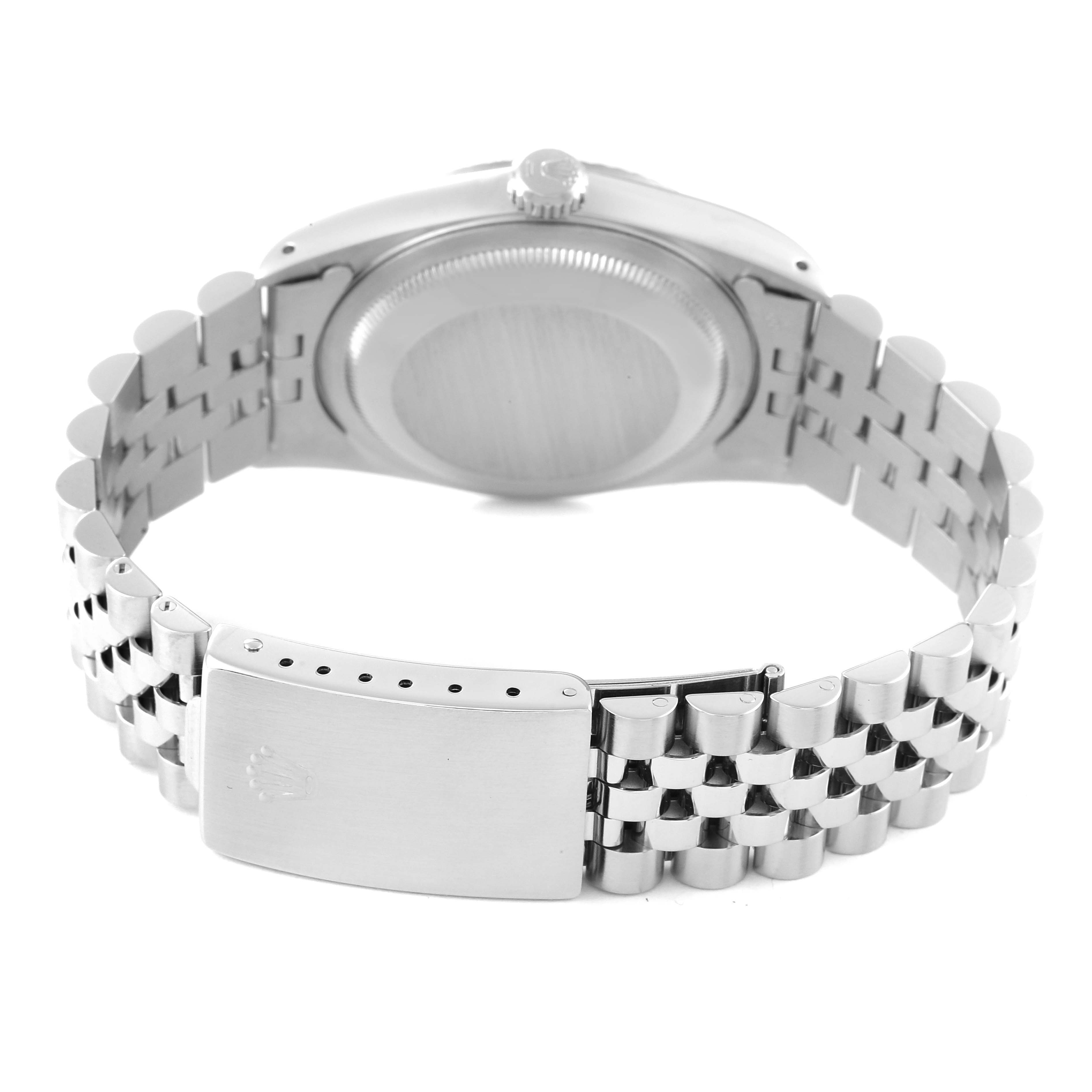 This image shows the backside of a Rolex Datejust 16234 Men's Stainless Steel Silver Dial 16234 Men's Stainless Steel Silver Dial watch, focusing on the case back and the Jubilee bracelet with its clasp.