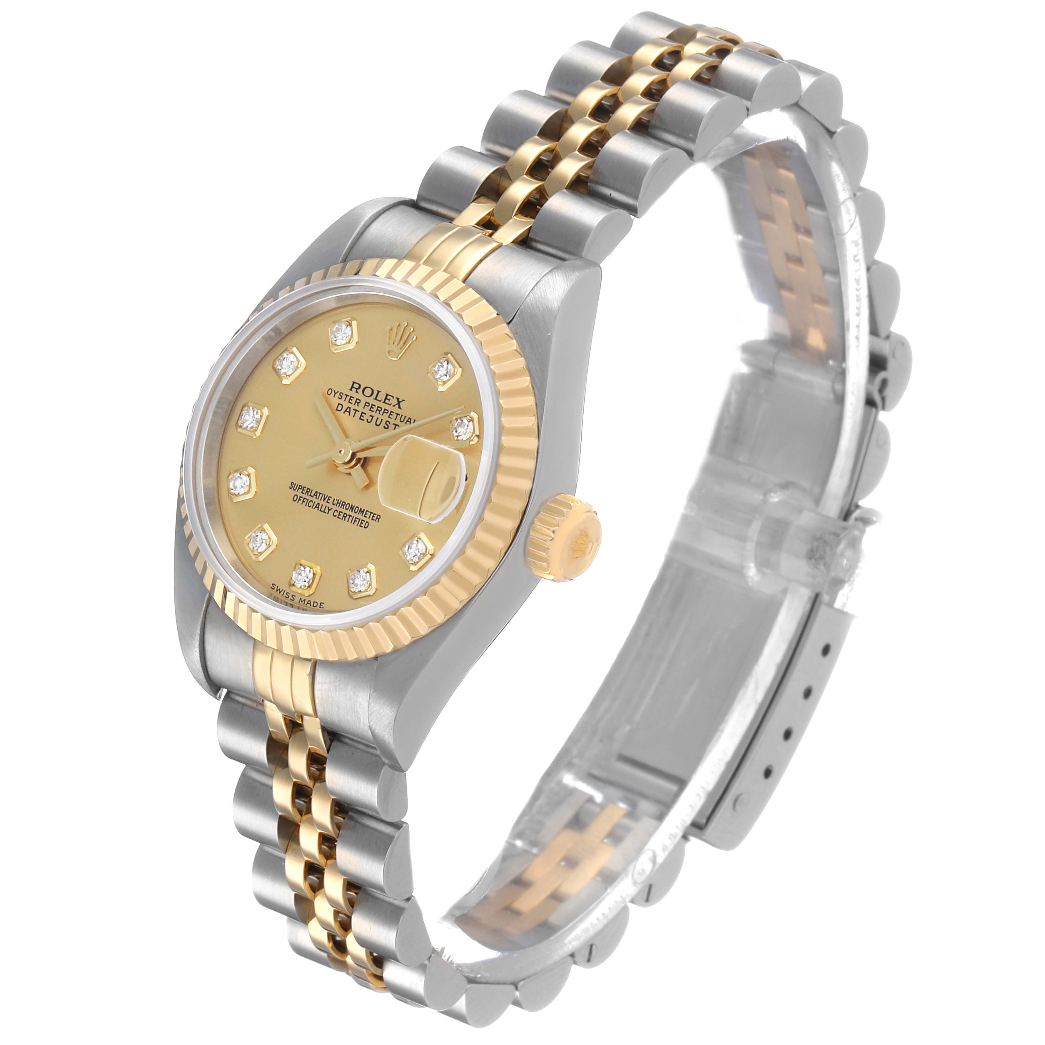 The Rolex Datejust 79173 Women's Stainless Steel Champagne Dial watch is shown at a three-quarter angle, displaying its gold face, diamond markers, fluted bezel, and two-tone bracelet.