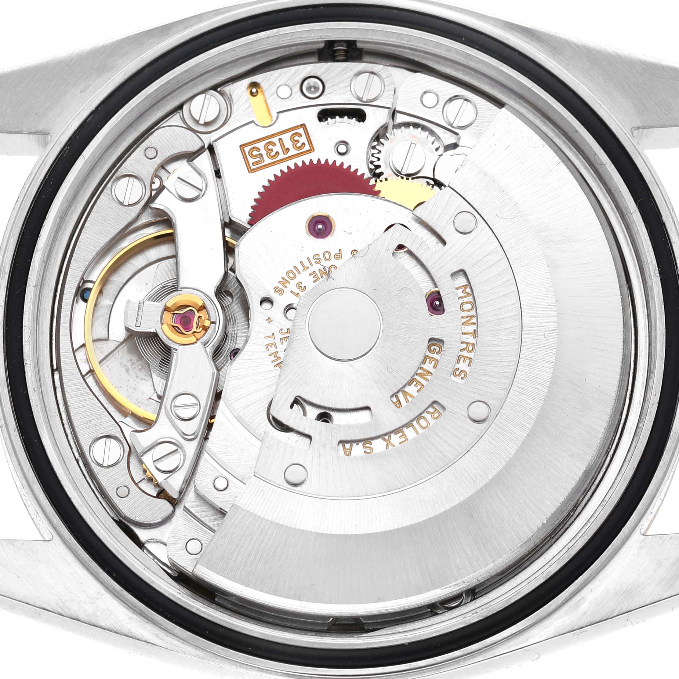 The image shows the backside and inner mechanism of a Rolex Datejust 16233 Men's Stainless Steel Champagne Dial watch, highlighting the movement components.
