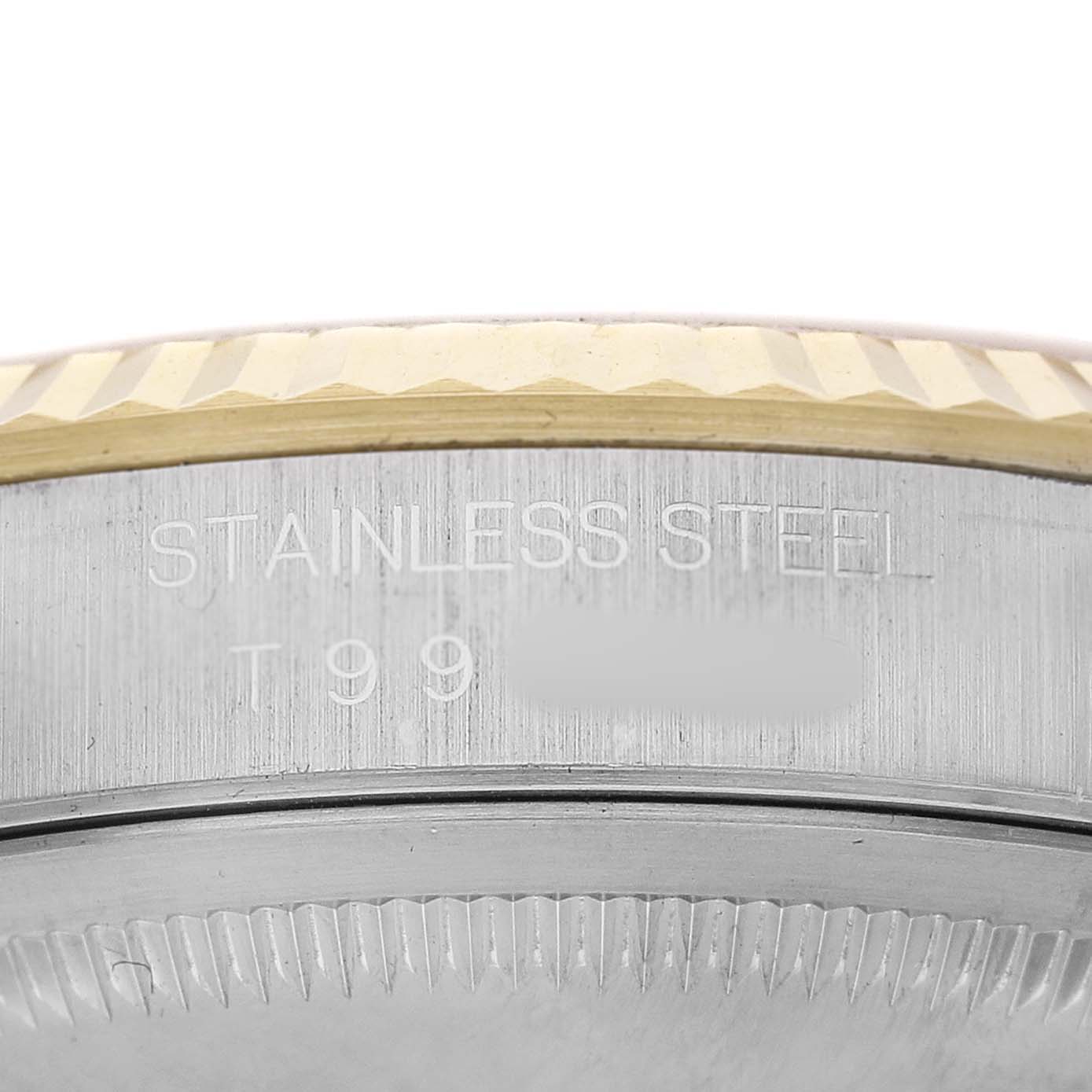 The image shows the side of a Rolex Datejust 16233 Men's Stainless Steel Champagne Dial watch case, highlighting the stainless steel inscription and bezel details.
