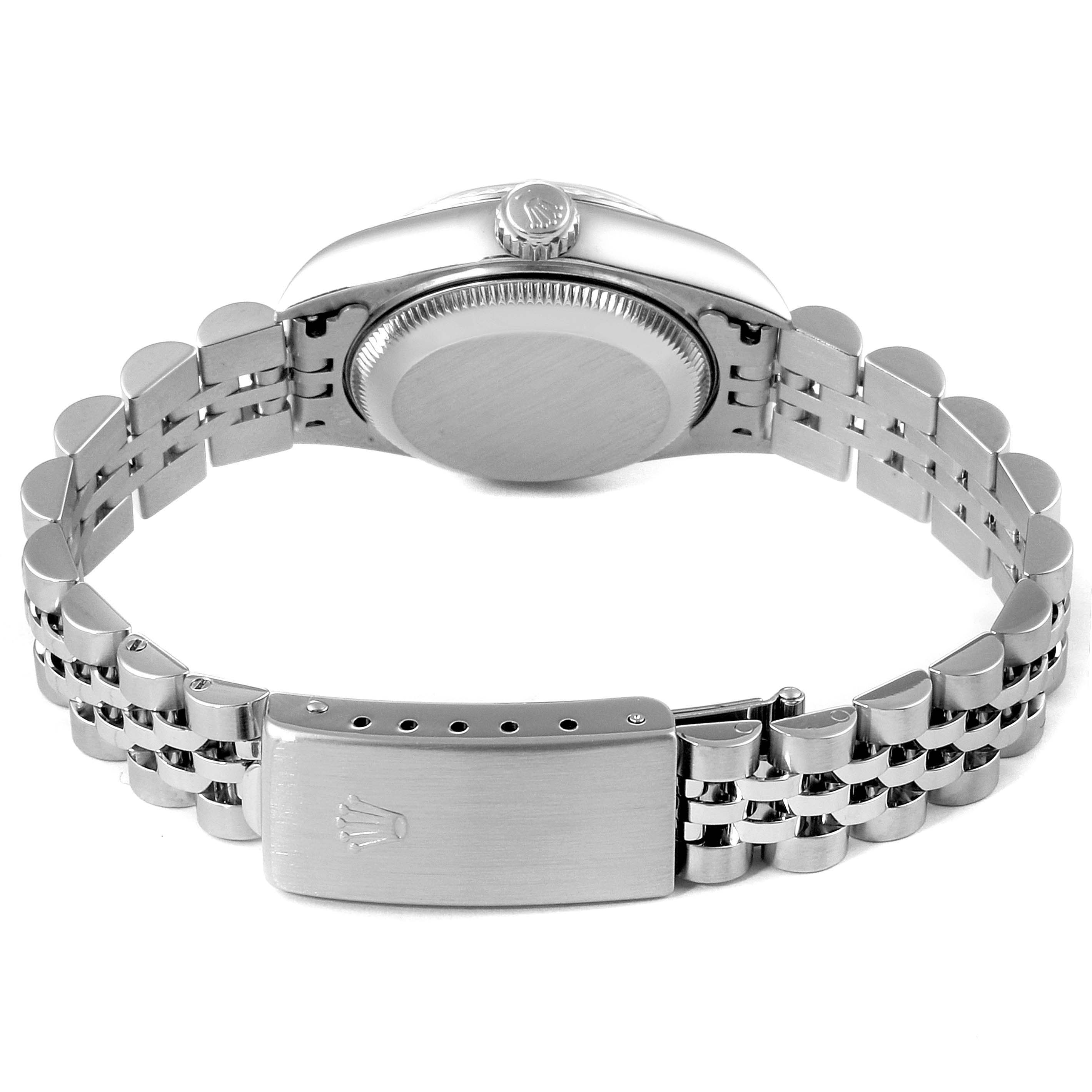 The image shows the backside of the Rolex Datejust 79174 Women's Stainless Steel Mother of Pearl Dial 79174 Women's Stainless Steel Mother of Pearl Dial watch, highlighting its case back, crown, and Jubilee bracelet with clasp.