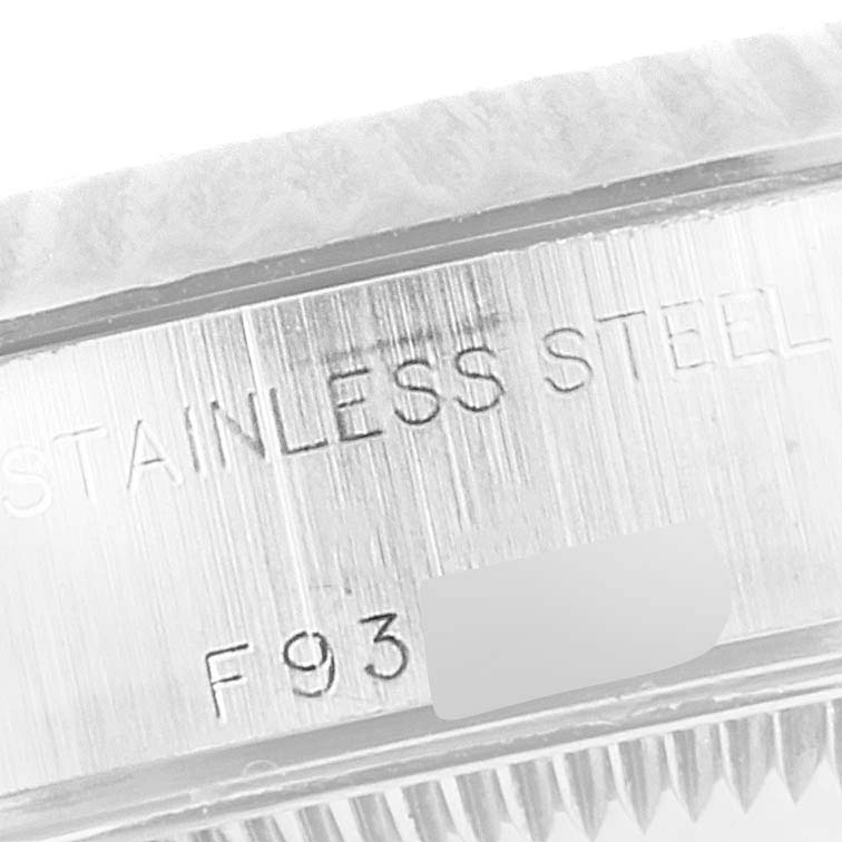This is a close-up angle of the side of a Rolex Datejust 79174 Women's Stainless Steel Mother of Pearl Dial 79174 Women's Stainless Steel Mother of Pearl Dial's stainless steel case, displaying the serial number area.