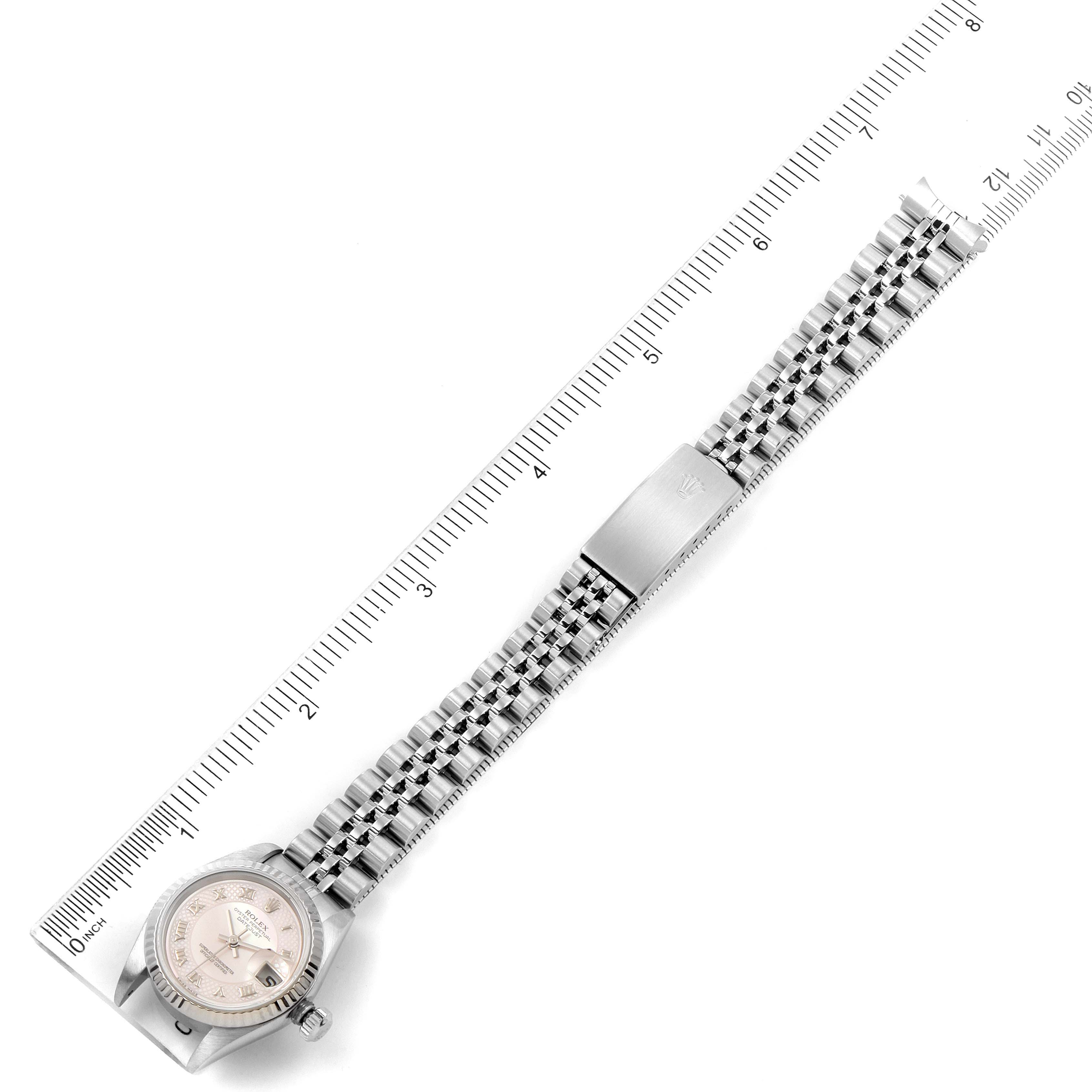 The image shows a top-down view of a Rolex Datejust 79174 Women's Stainless Steel Mother of Pearl Dial 79174 Women's Stainless Steel Mother of Pearl Dial watch with a ruler alongside the bracelet for measurement.