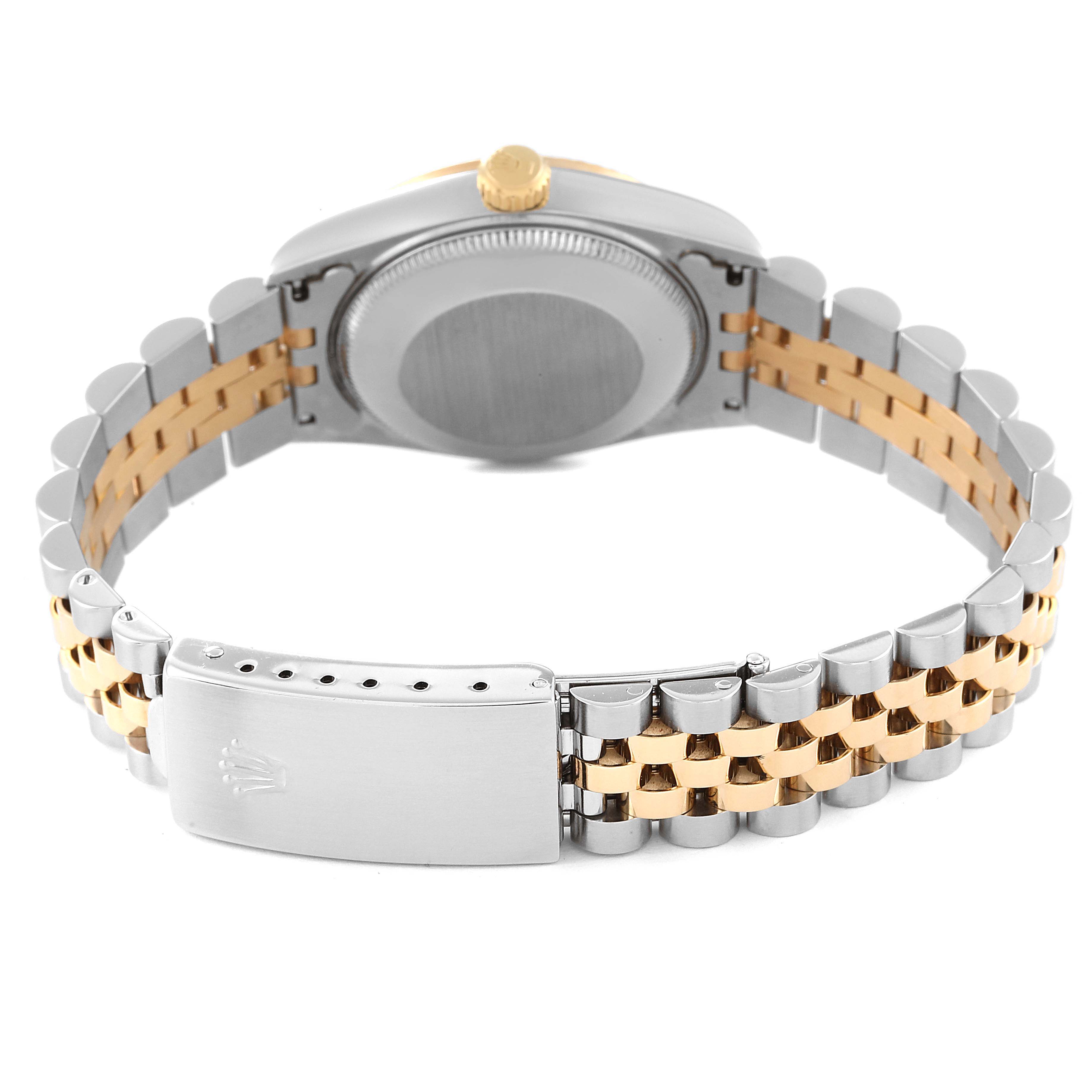 This image shows the back of a mid-size Rolex watch, including the case back, crown, and the two-tone jubilee bracelet with the folded clasp.