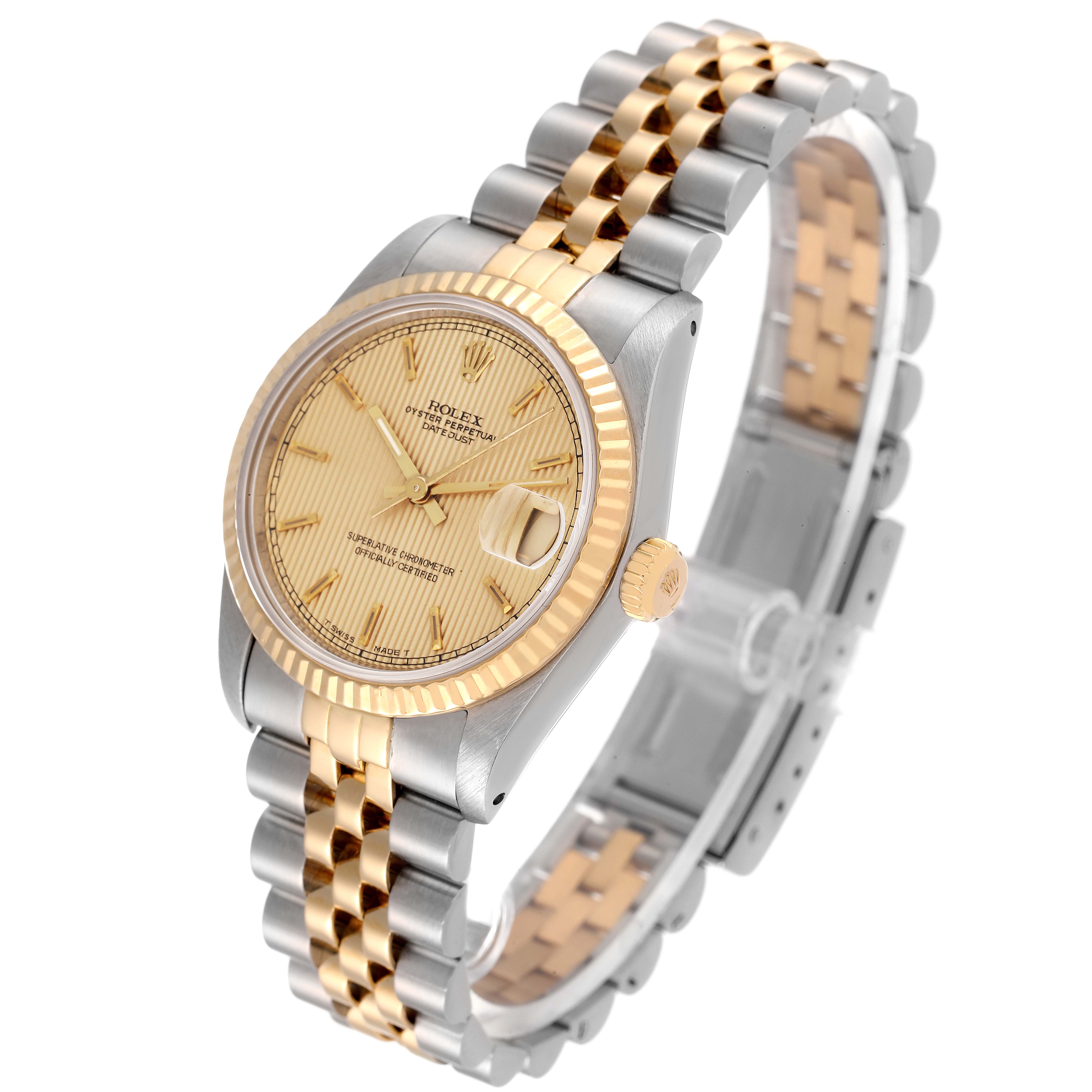 The image shows a Rolex Mid-Size 68273 Women
s Steel and Gold (two tone) Champagne Dial 68273 Women
s Steel and Gold (two tone) Champagne Dial watch at a three-quarter angle, highlighting its two-tone bracelet and fluted bezel.