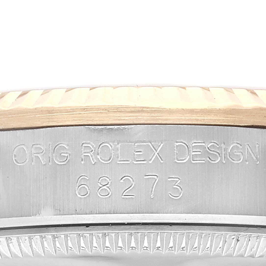 The image shows the side profile of the case of a Mid-Size Rolex watch, revealing the engraved model reference number 68273.