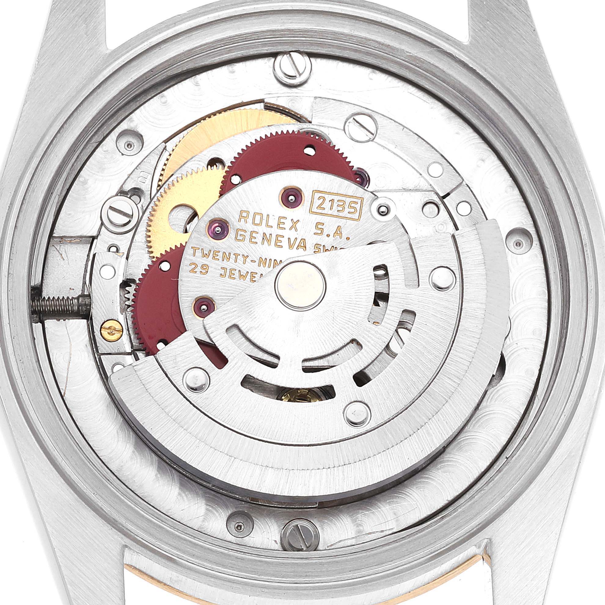 This close-up image shows the inner mechanical workings of a Rolex Mid-Size 68273 Women
s Steel and Gold (two tone) Champagne Dial 68273 Women
s Steel and Gold (two tone) Champagne Dial watch, highlighting its gears and movement parts.