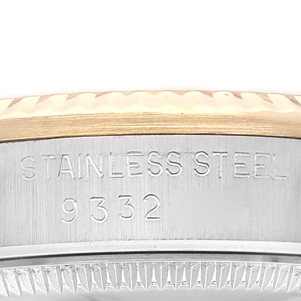 This close-up image shows the side of a Mid-Size Rolex watch, highlighting its stainless steel and gold bezel with model number 9332.