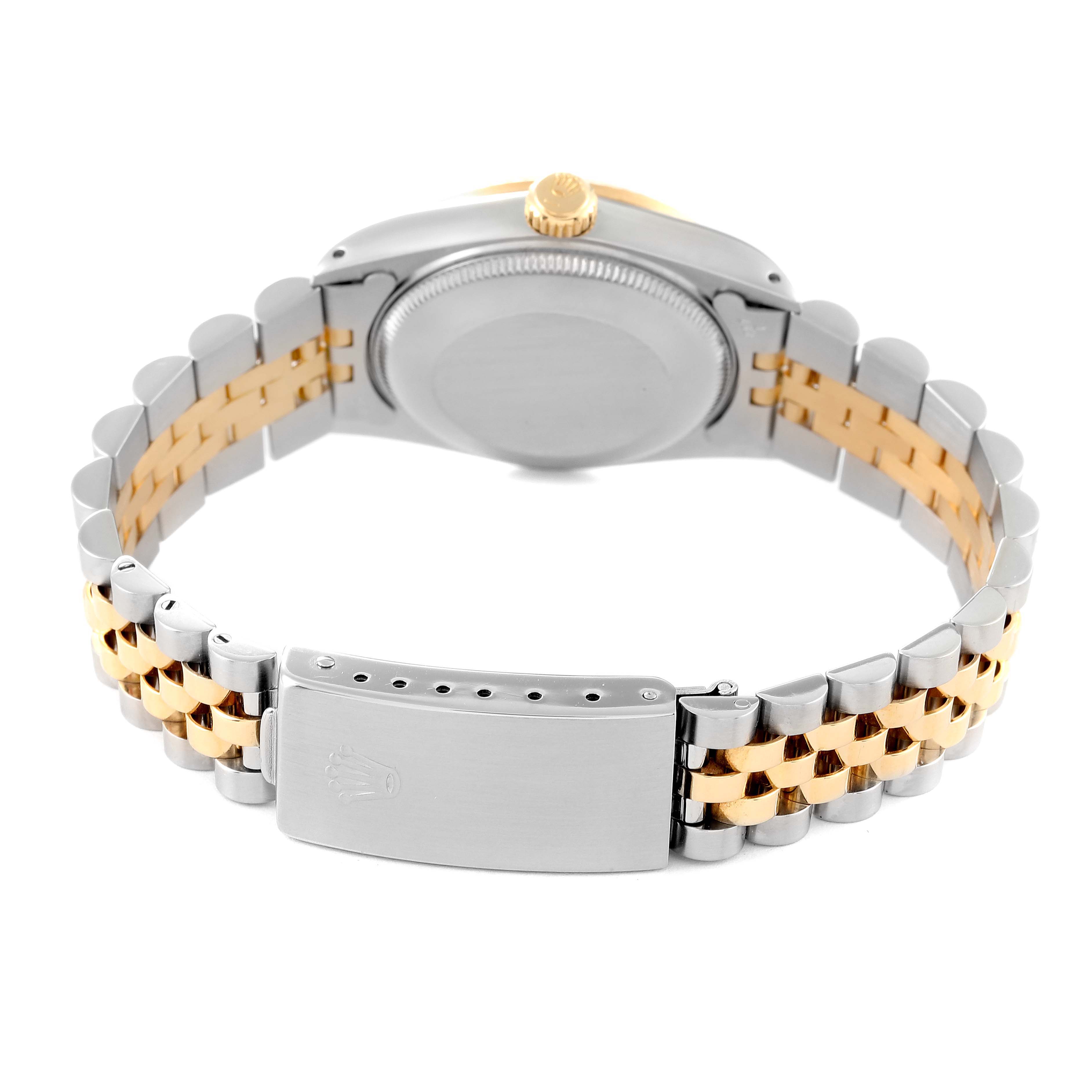 The image shows the back of the mid-size Rolex watch, highlighting the two-tone Jubilee bracelet and clasp.
