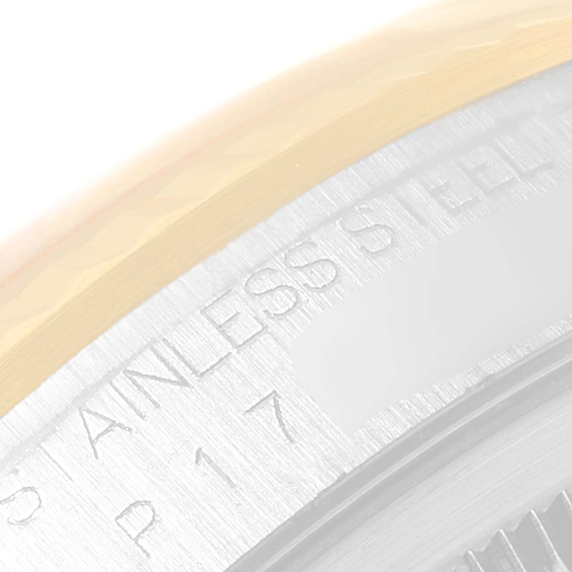The image shows a close-up angle of the "STAINLESS STEEL" engraving on the casing of a Rolex Datejust 16233 Men's Steel and Gold (two tone) Black Dial 16233 Men's Steel and Gold (two tone) Black Dial watch.
