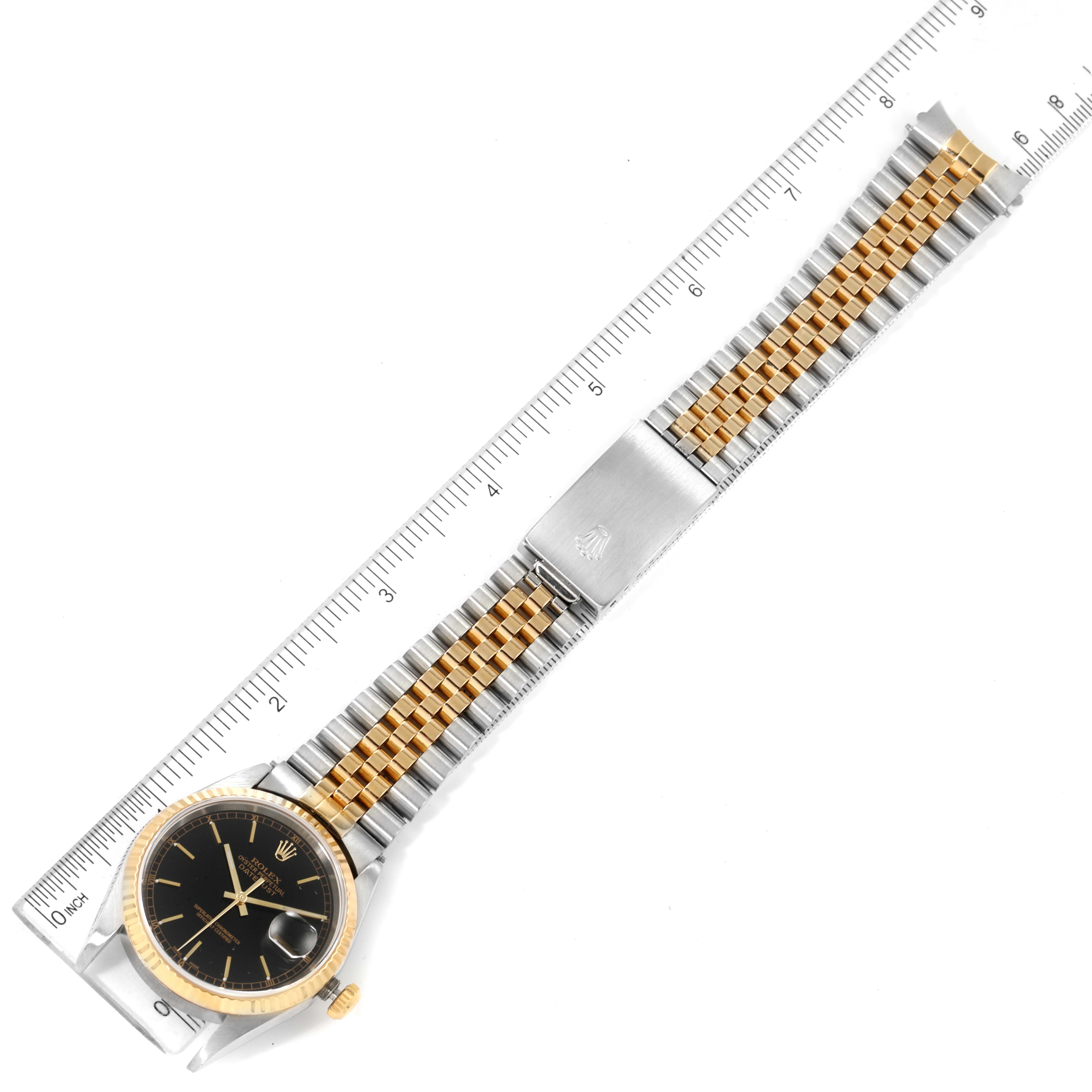 The Rolex Datejust 16233 Men's Steel and Gold (two tone) Black Dial 16233 Men's Steel and Gold (two tone) Black Dial watch is shown from the top, displaying its black dial, gold bezel, and two-tone bracelet.