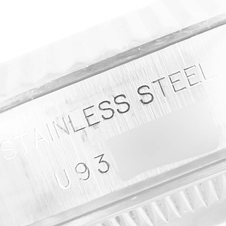 This close-up image shows the "STAINLESS STEEL" engraving on the case of a Rolex Datejust 69174 Women's Stainless Steel Pink Dial 69174 Women's Stainless Steel Pink Dial watch.