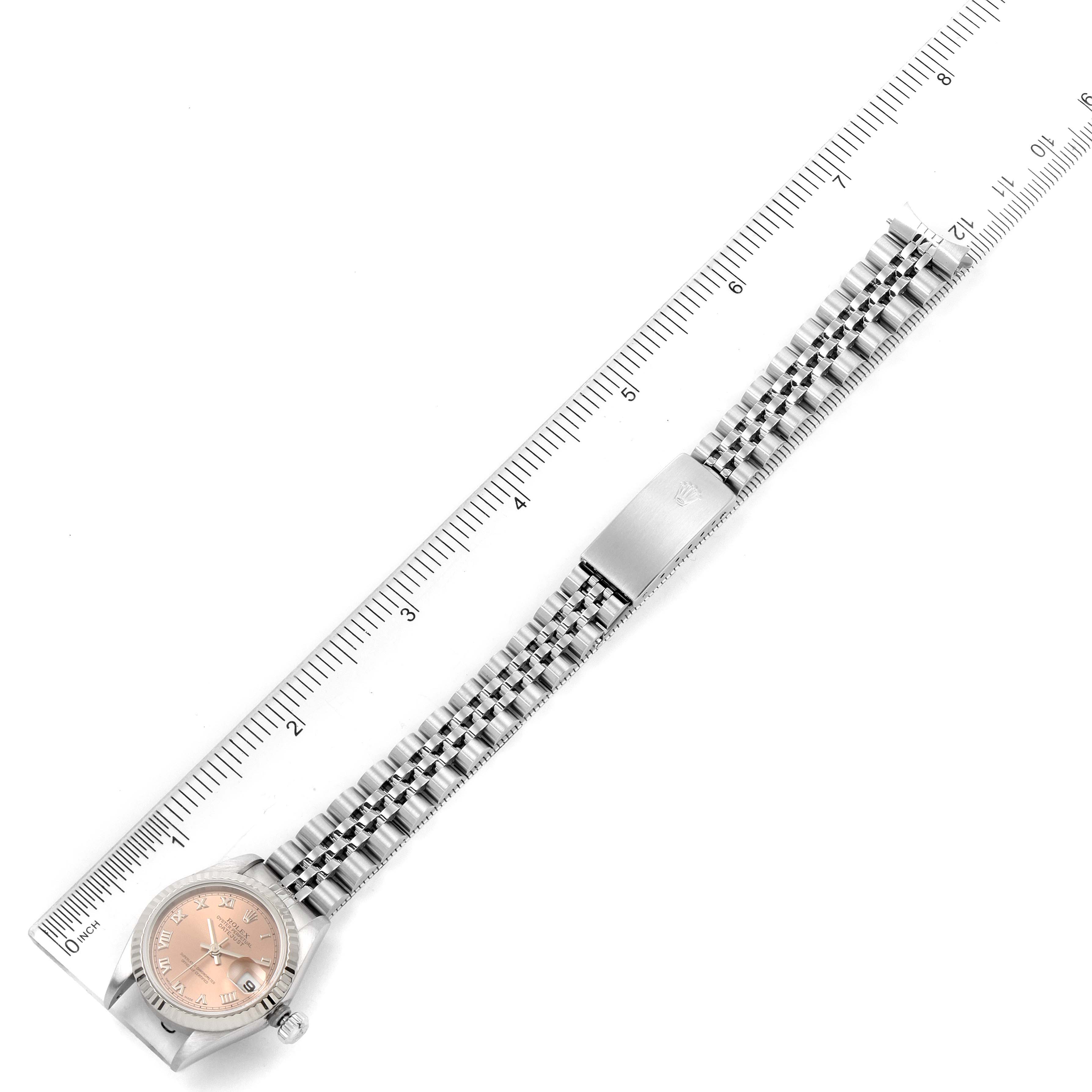 This image shows a top-down view of a Rolex Datejust 69174 Women's Stainless Steel Pink Dial 69174 Women's Stainless Steel Pink Dial watch, displaying the full bracelet with a clasp and the dial.