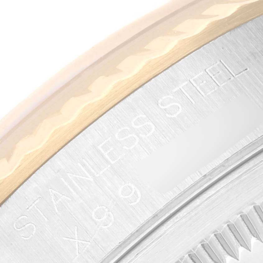 The image shows a close-up of the stainless steel and fluted bezel on a Rolex Datejust 16233 Men's Steel and Gold (two tone) Black Dial 16233 Men's Steel and Gold (two tone) Black Dial model.