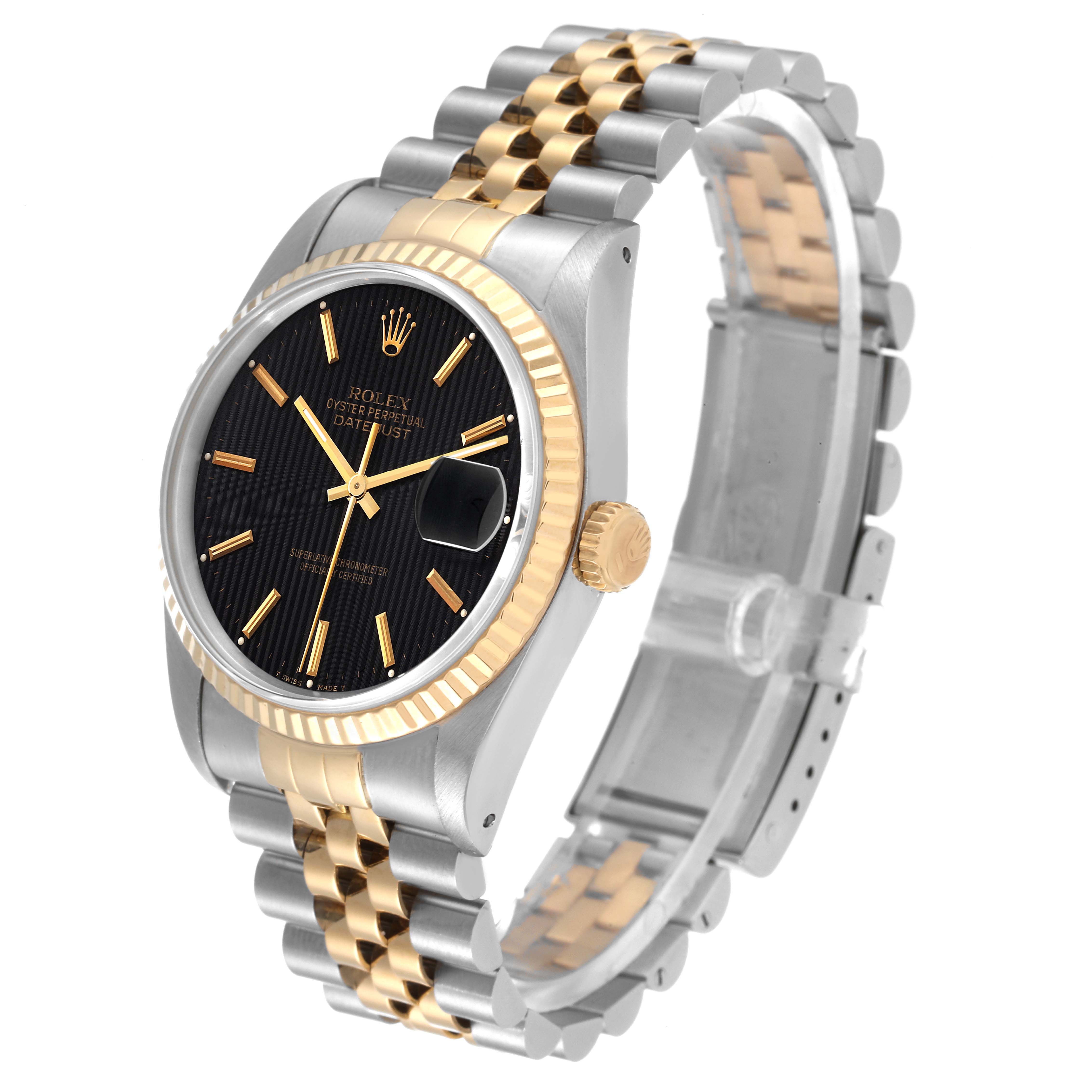 The image shows a Rolex Datejust 16233 Men's Steel and Gold (two tone) Black Dial 16233 Men's Steel and Gold (two tone) Black Dial watch at a three-quarter angle, highlighting the two-tone bracelet, black dial, fluted bezel, and date function.