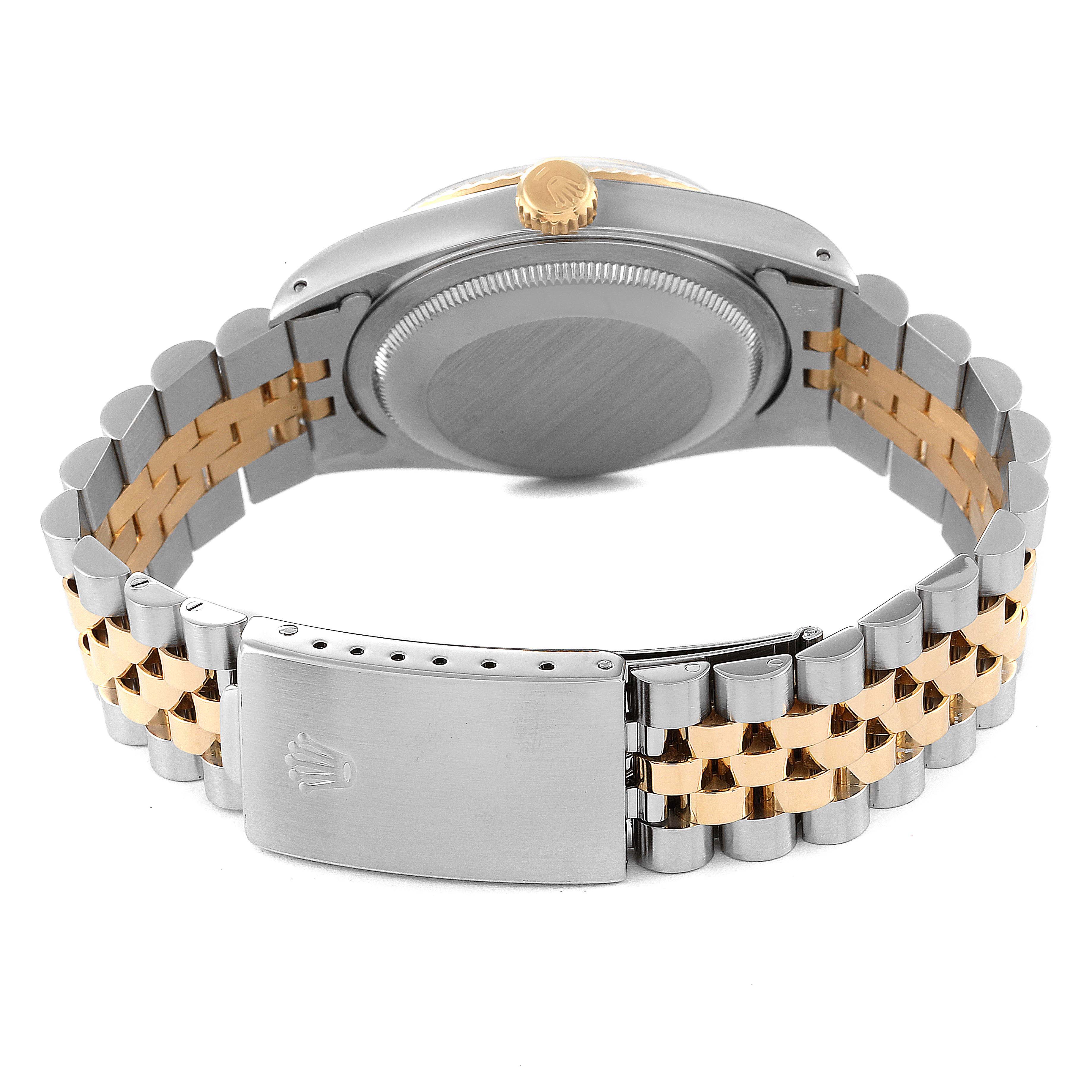 The image shows the back view of a Rolex Datejust 16233 Men's Steel and Gold (two tone) Black Dial 16233 Men's Steel and Gold (two tone) Black Dial watch, highlighting its case back and Jubilee bracelet.