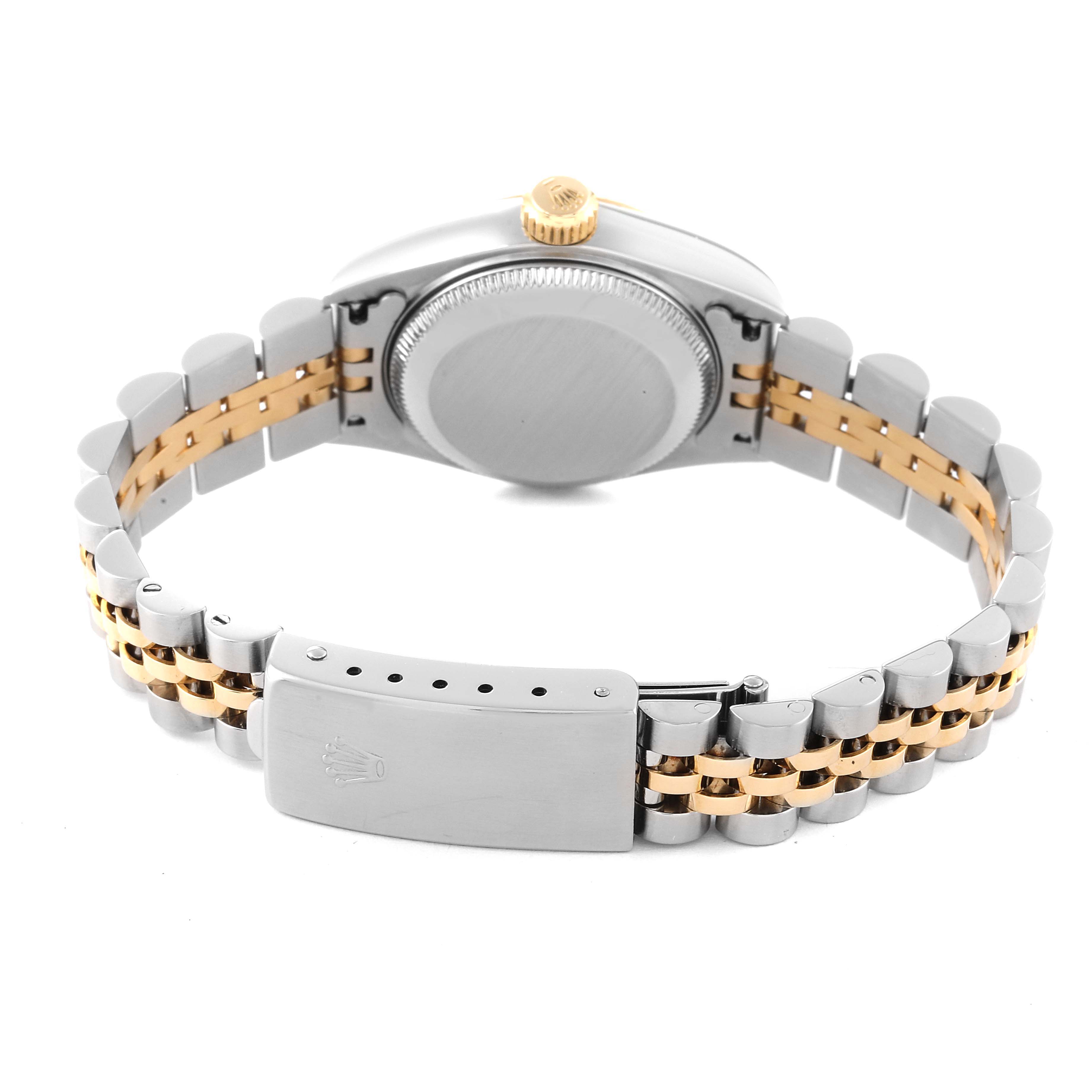 The image shows the Rolex Datejust 79173 Women's Steel and Gold (two tone) Champagne Dial 79173 Women's Steel and Gold (two tone) Champagne Dial watch from a rear angle, highlighting the case back and stainless steel and gold bracelet.