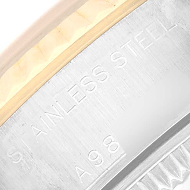 The image shows an angled close-up of the side of a Rolex Datejust 79173 Women's Steel and Gold (two tone) Black Dial 79173 Women's Steel and Gold (two tone) Black Dial watch, highlighting the "Stainless Steel" engraving.
