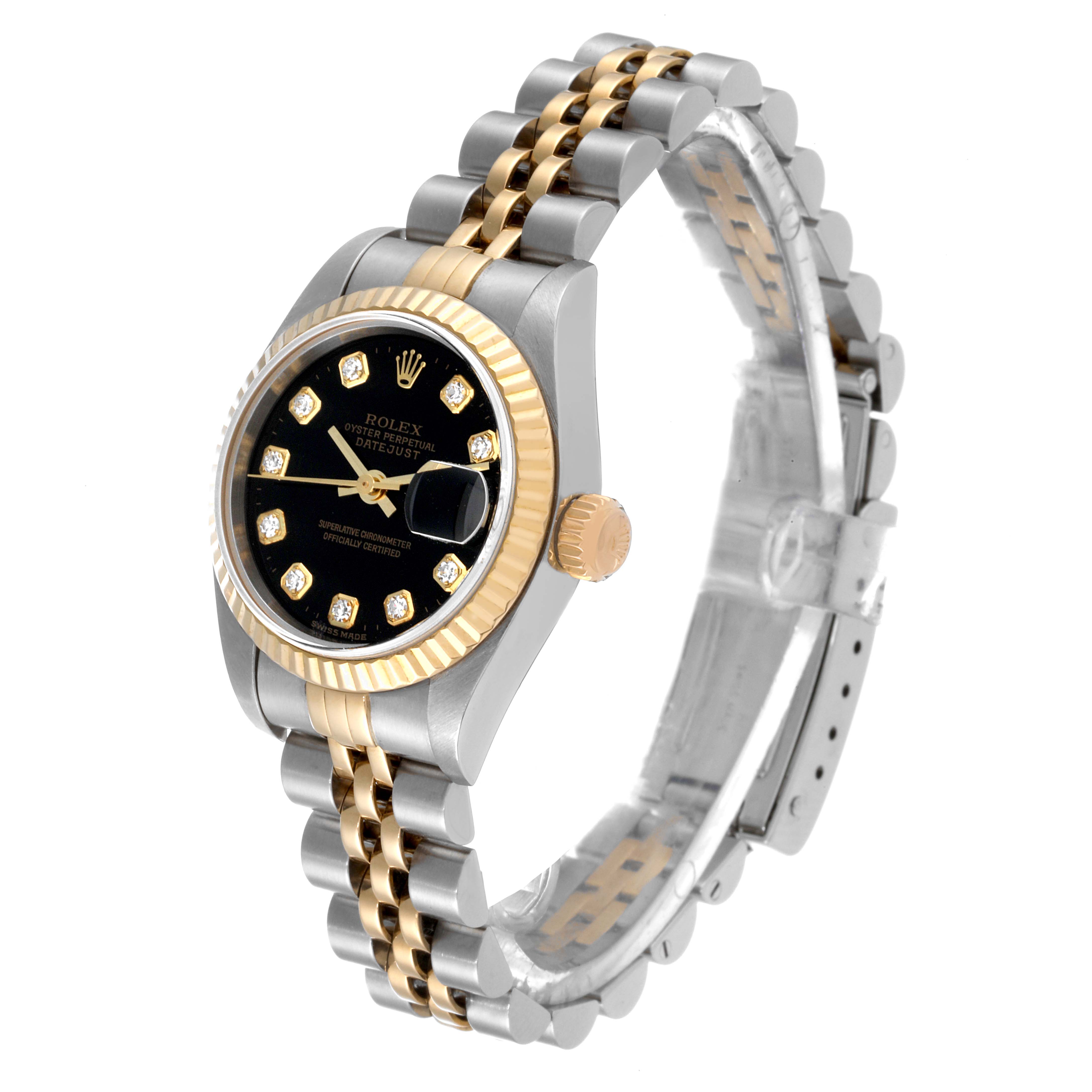 This Rolex Datejust 79173 Women's Steel and Gold (two tone) Black Dial 79173 Women's Steel and Gold (two tone) Black Dial watch is shown at a three-quarter angle, displaying its gold and silver bracelet, black dial, and fluted bezel.
