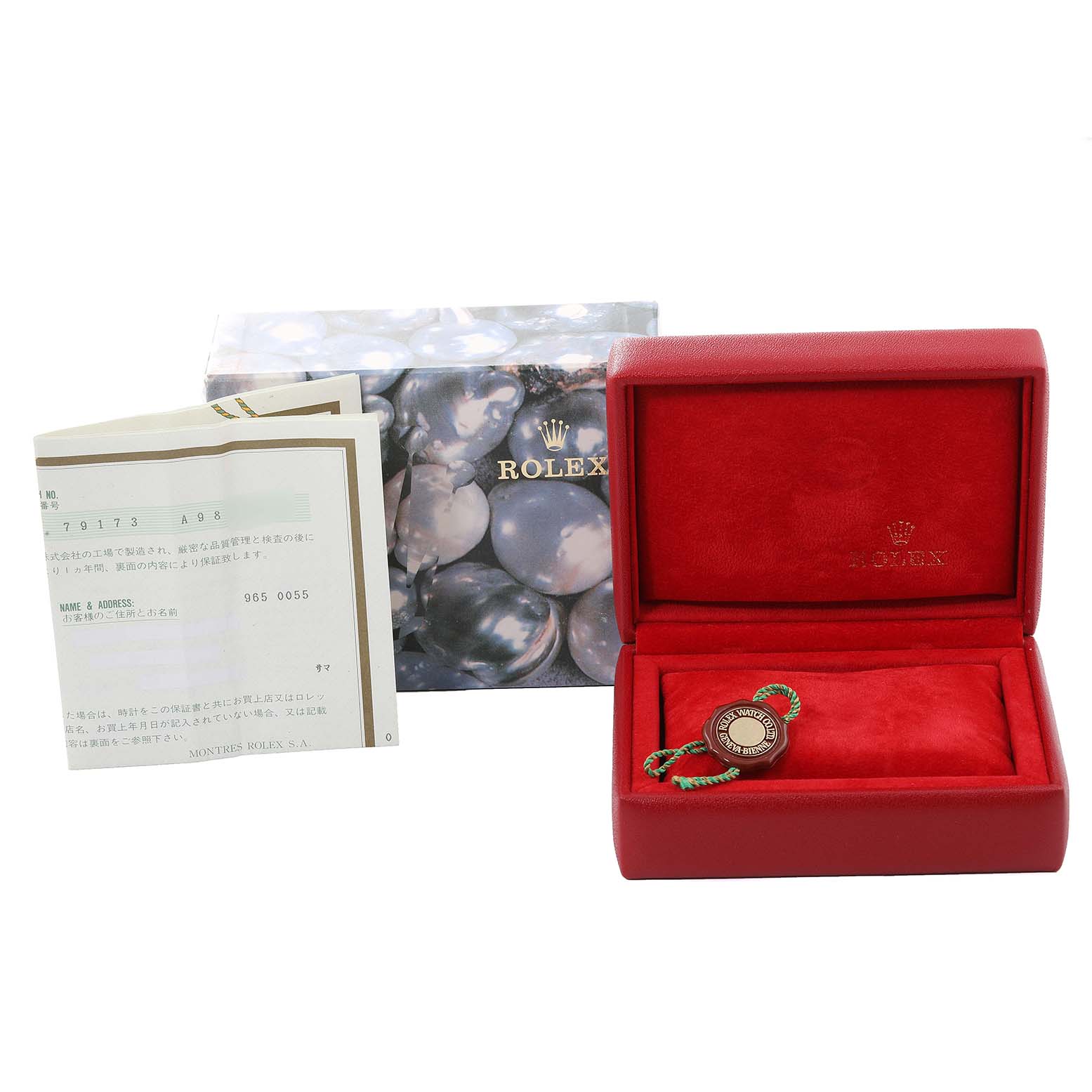 The image shows the packaging, guarantee card, and tag for a Rolex Datejust 79173 Women's Steel and Gold (two tone) Black Dial 79173 Women's Steel and Gold (two tone) Black Dial watch with an empty red watch box.