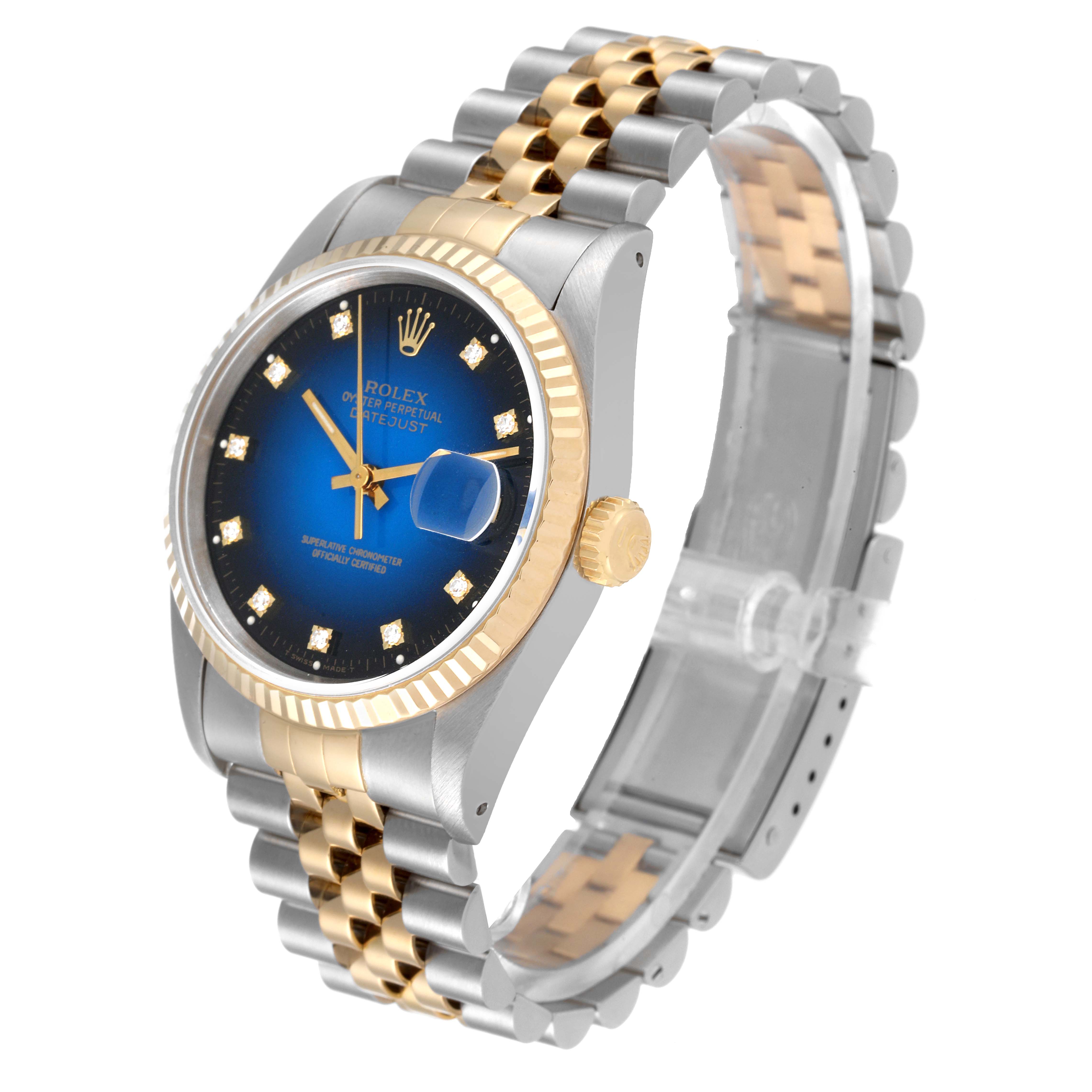 This image shows a Rolex Datejust 16233 Men's Steel and Gold (two tone) Blue Dial 16233 Men's Steel and Gold (two tone) Blue Dial watch at an angle highlighting its blue dial, gold fluted bezel, and two-tone Jubilee bracelet.