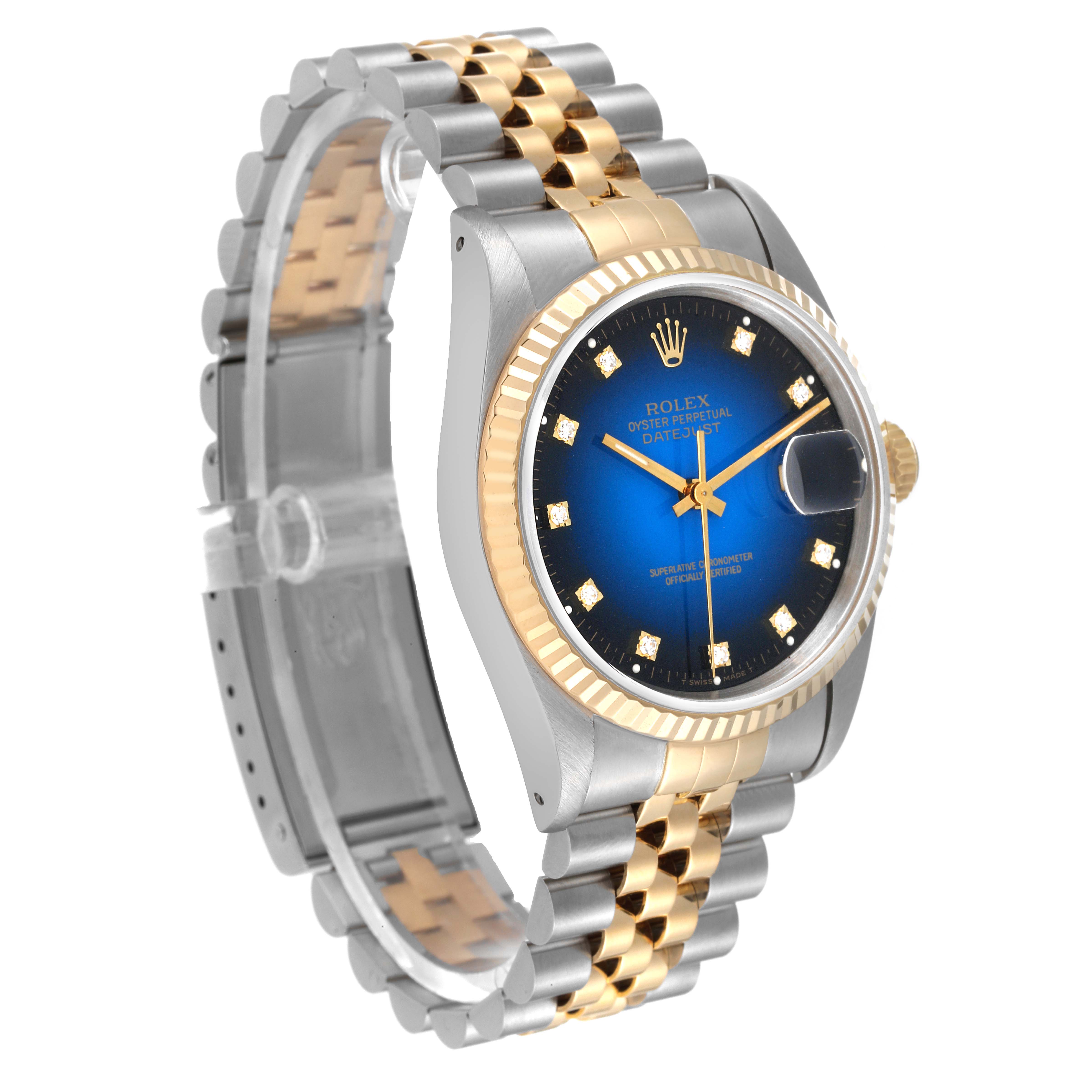 The image shows a Rolex Datejust 16233 Men's Steel and Gold (two tone) Blue Dial 16233 Men's Steel and Gold (two tone) Blue Dial watch with a gold and silver two-tone jubilee bracelet, fluted bezel, and blue dial.