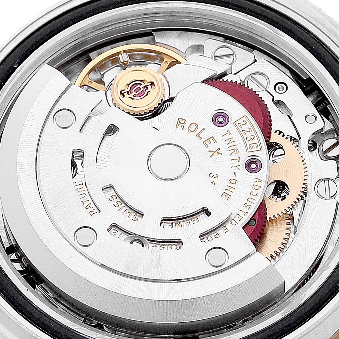 This is a close-up view of the movement mechanism of a Rolex Datejust 279163 Women's Steel and Gold (two tone) Mother of Pearl Dial 279163 Women's Steel and Gold (two tone) Mother of Pearl Dial watch, showcasing gears and intricate details.