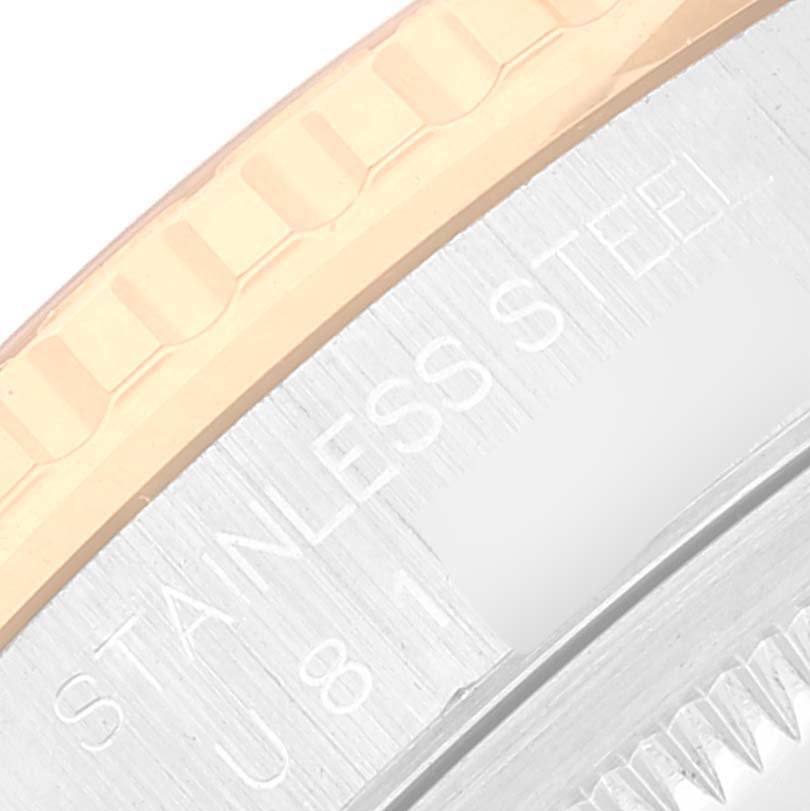 This image shows a close-up of the bezel and case back of a Rolex Turn-o-Graph 16263 Men's Steel and Gold (two tone) Champagne Dial 16263 Men's Steel and Gold (two tone) Champagne Dial watch, highlighting the stainless steel text.