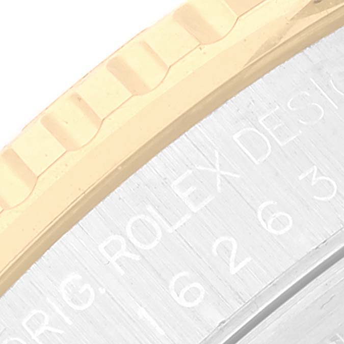 The image shows a close-up of the bezel and engraved case of the Rolex Turn-o-Graph 16263 Men's Steel and Gold (two tone) Champagne Dial 16263 Men's Steel and Gold (two tone) Champagne Dial watch.