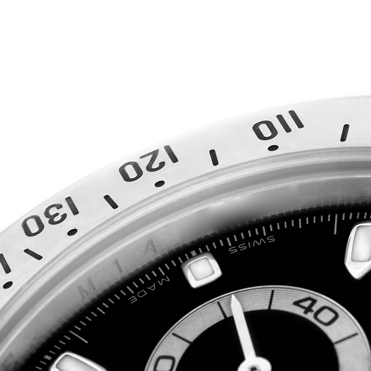 The image shows a close-up of the bezel and part of the dial of the Rolex Daytona 116520 Men's Stainless Steel Black Dial watch, highlighting the tachymeter scale and sub-dial.