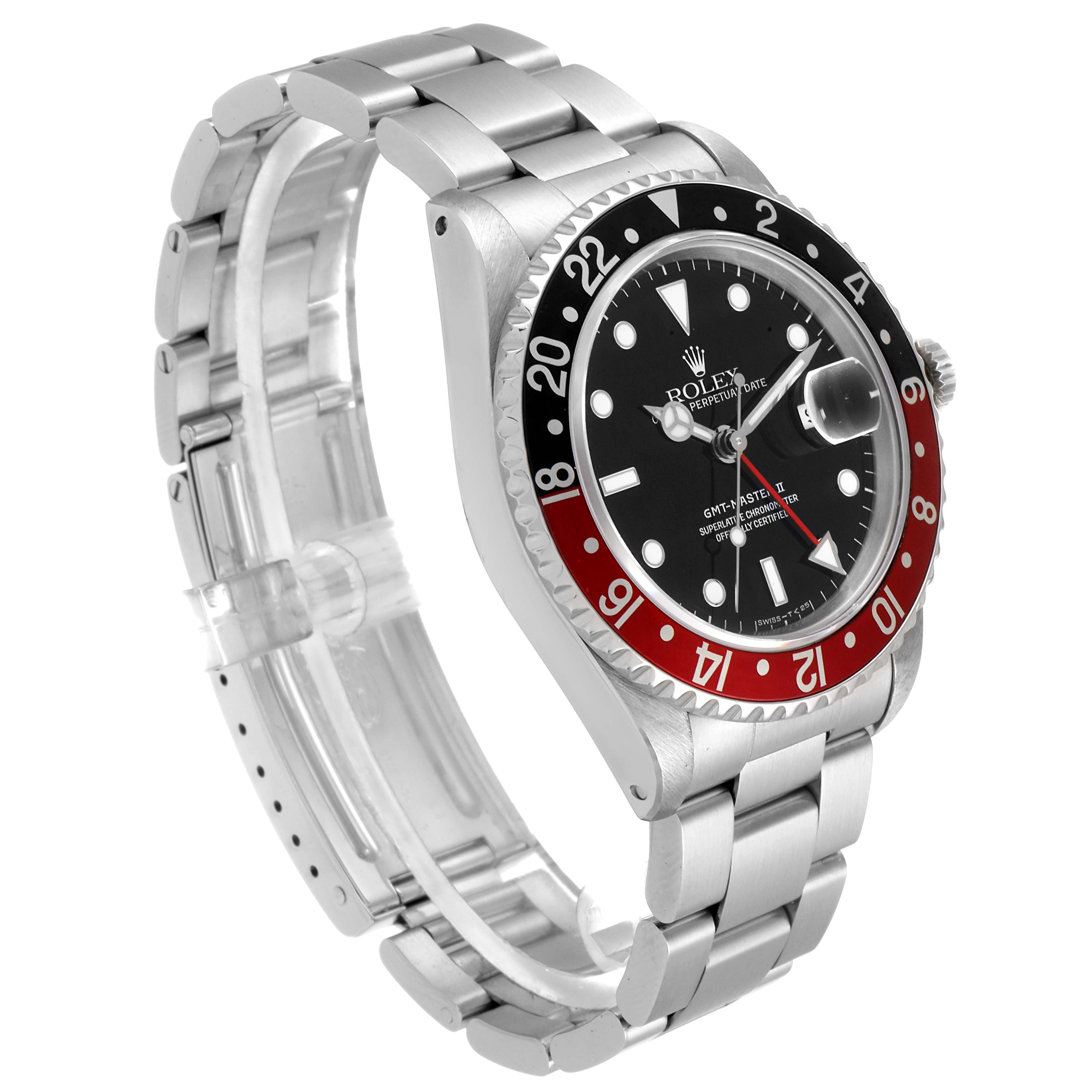 This image shows a side angle of the Rolex GMT-Master 16710 Men's Stainless Steel Black Dial 16710 Men's Stainless Steel Black Dial watch, featuring its black and red bezel, black dial, and stainless steel band.
