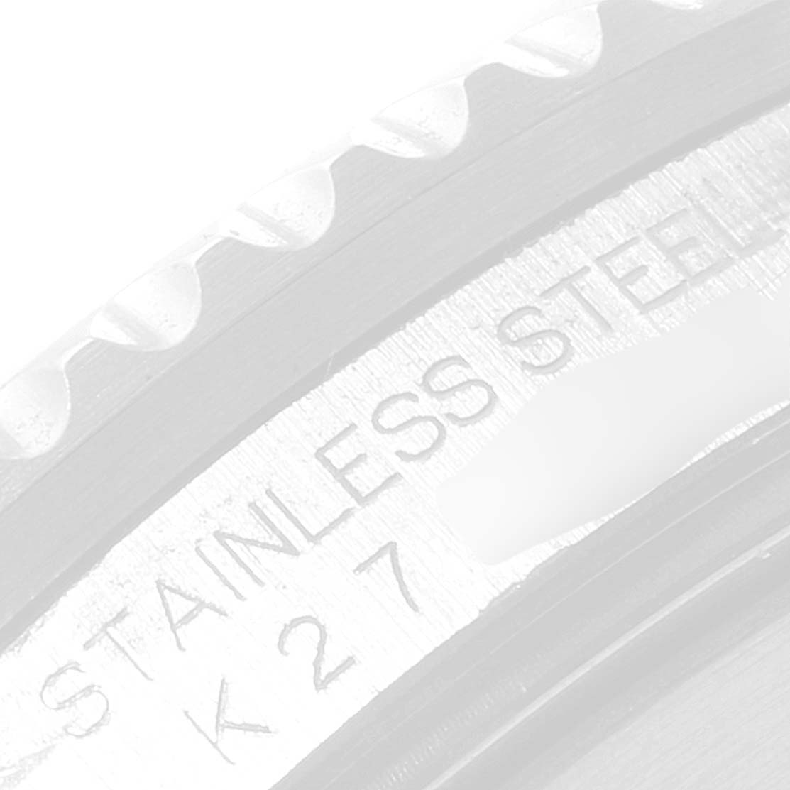 The image shows a close-up of the stainless steel engravings and part of the bezel of a Rolex GMT-Master 16710 Men
s Stainless Steel Black Dial 16710 Men
s Stainless Steel Black Dial watch.