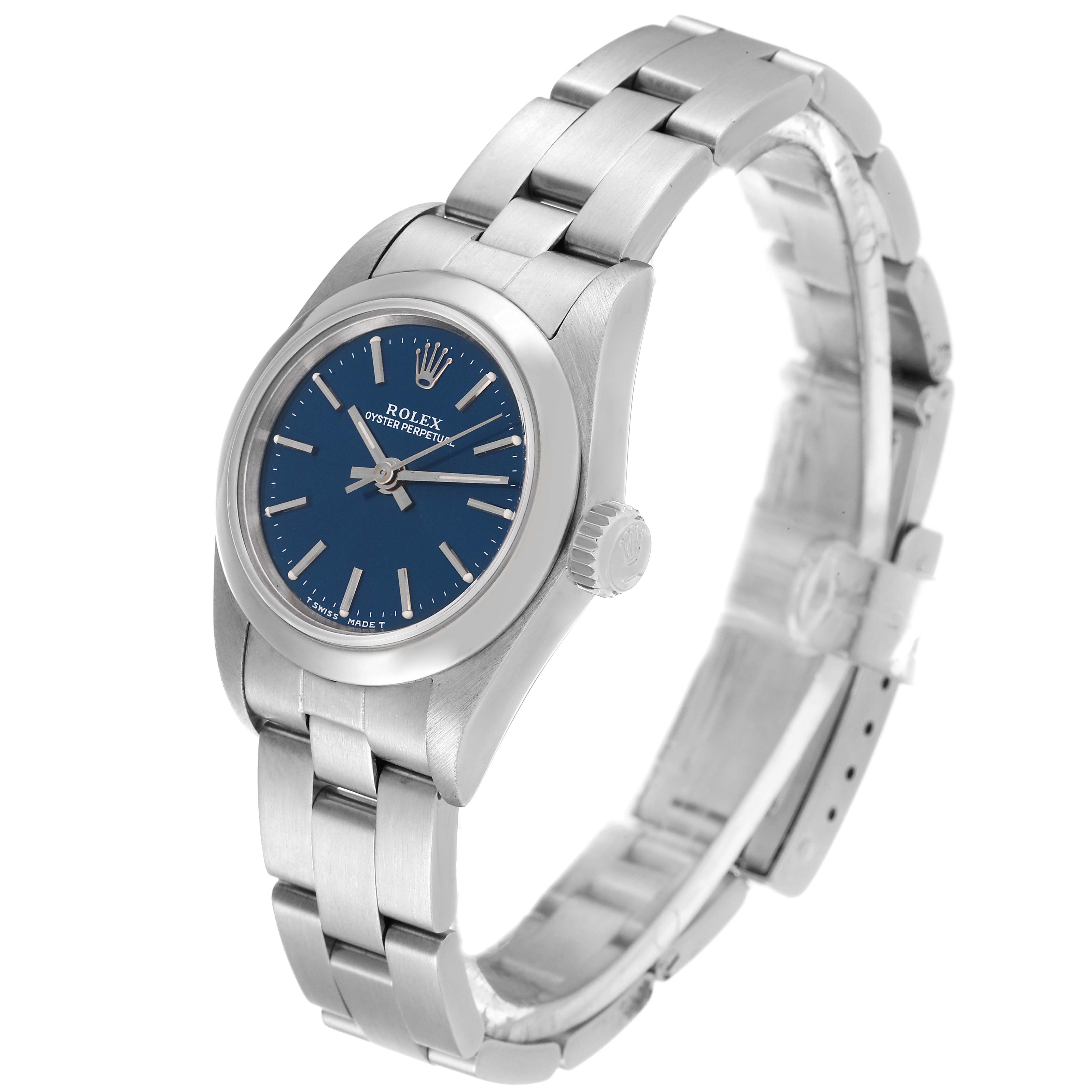This image shows an angled view of a Rolex Oyster Perpetual 67180 Women's Stainless Steel Blue Dial 67180 Women's Stainless Steel Blue Dial watch, focusing on the face, bezel, crown, and bracelet.