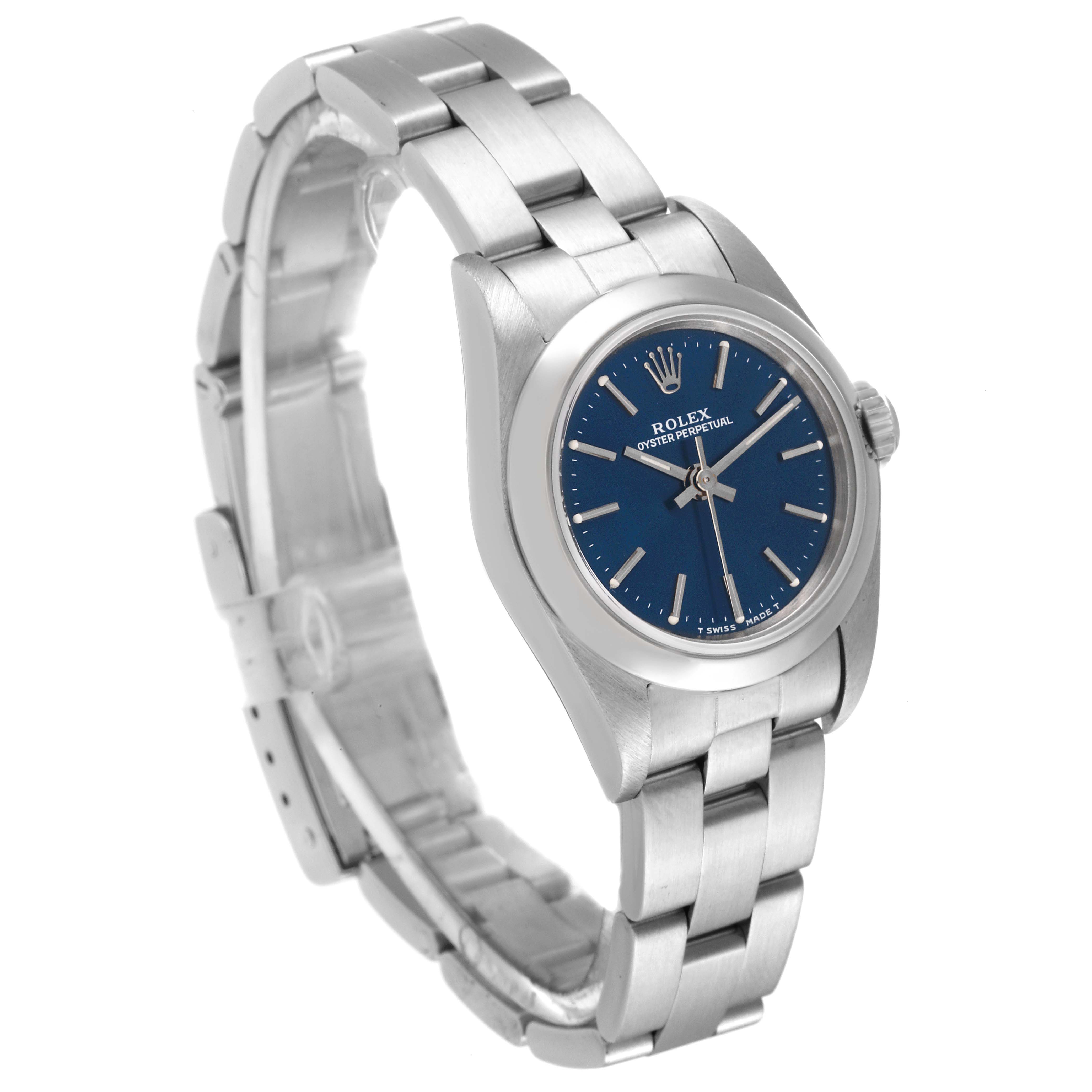 The image shows a Rolex Oyster Perpetual 67180 Women's Stainless Steel Blue Dial 67180 Women's Stainless Steel Blue Dial watch with a blue dial, silver markers, and stainless steel bracelet at an angled view.