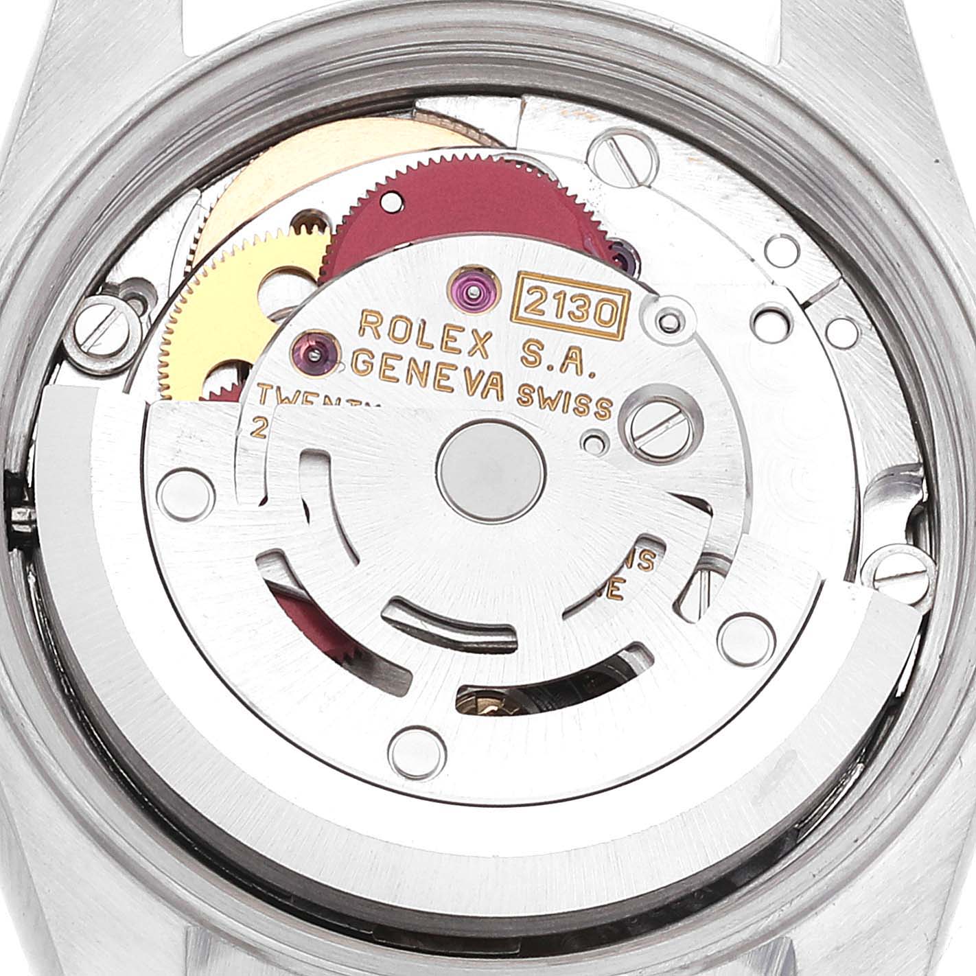 The image shows the inner mechanism of a Rolex Oyster Perpetual 67180 Women's Stainless Steel Blue Dial 67180 Women's Stainless Steel Blue Dial watch, highlighting the gears and rotor from the back angle.