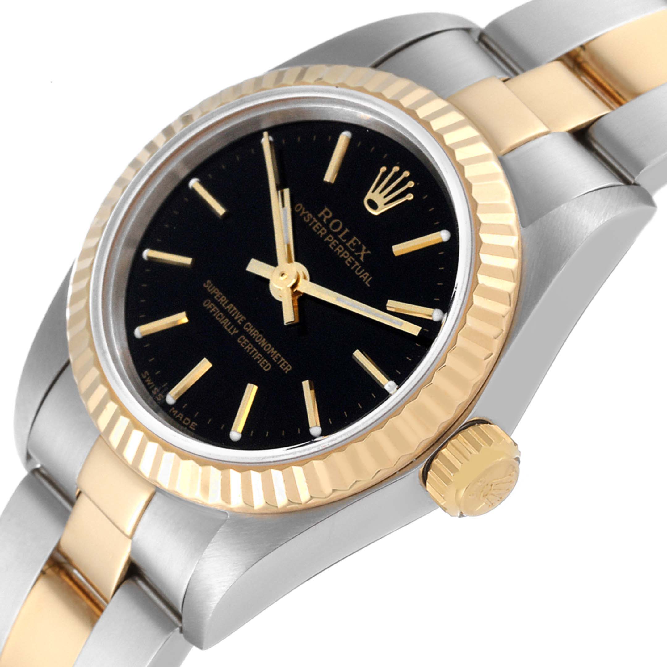 The image shows a close-up side view of the Rolex Oyster Perpetual 76193 Women's Steel and Gold (two tone) Black Dial 76193 Women's Steel and Gold (two tone) Black Dial watch, highlighting its bezel, crown, and part of the bracelet.