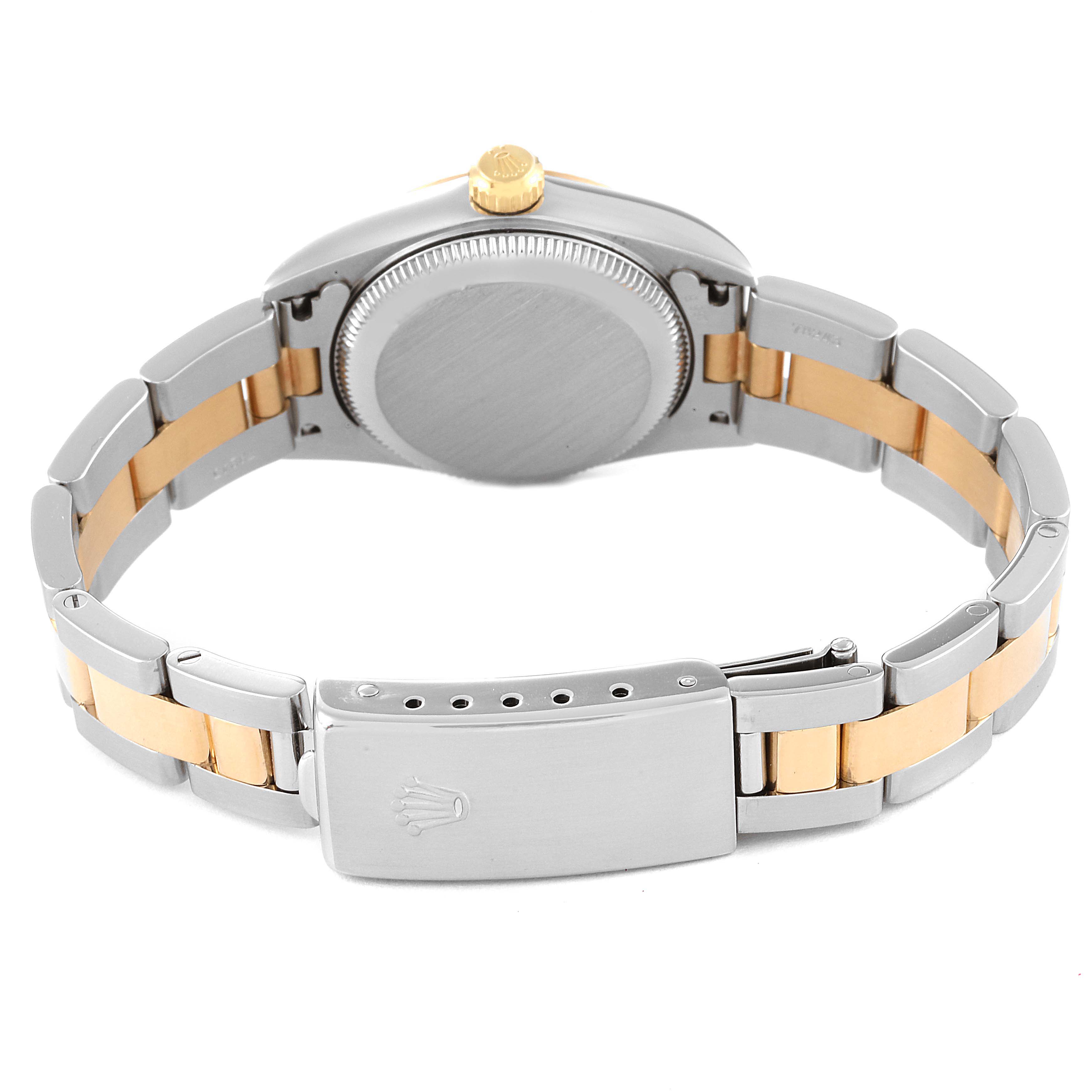 The image shows the back of a Rolex Oyster Perpetual 76193 Women's Steel and Gold (two tone) Black Dial 76193 Women's Steel and Gold (two tone) Black Dial watch, highlighting the case back and bracelet clasp.