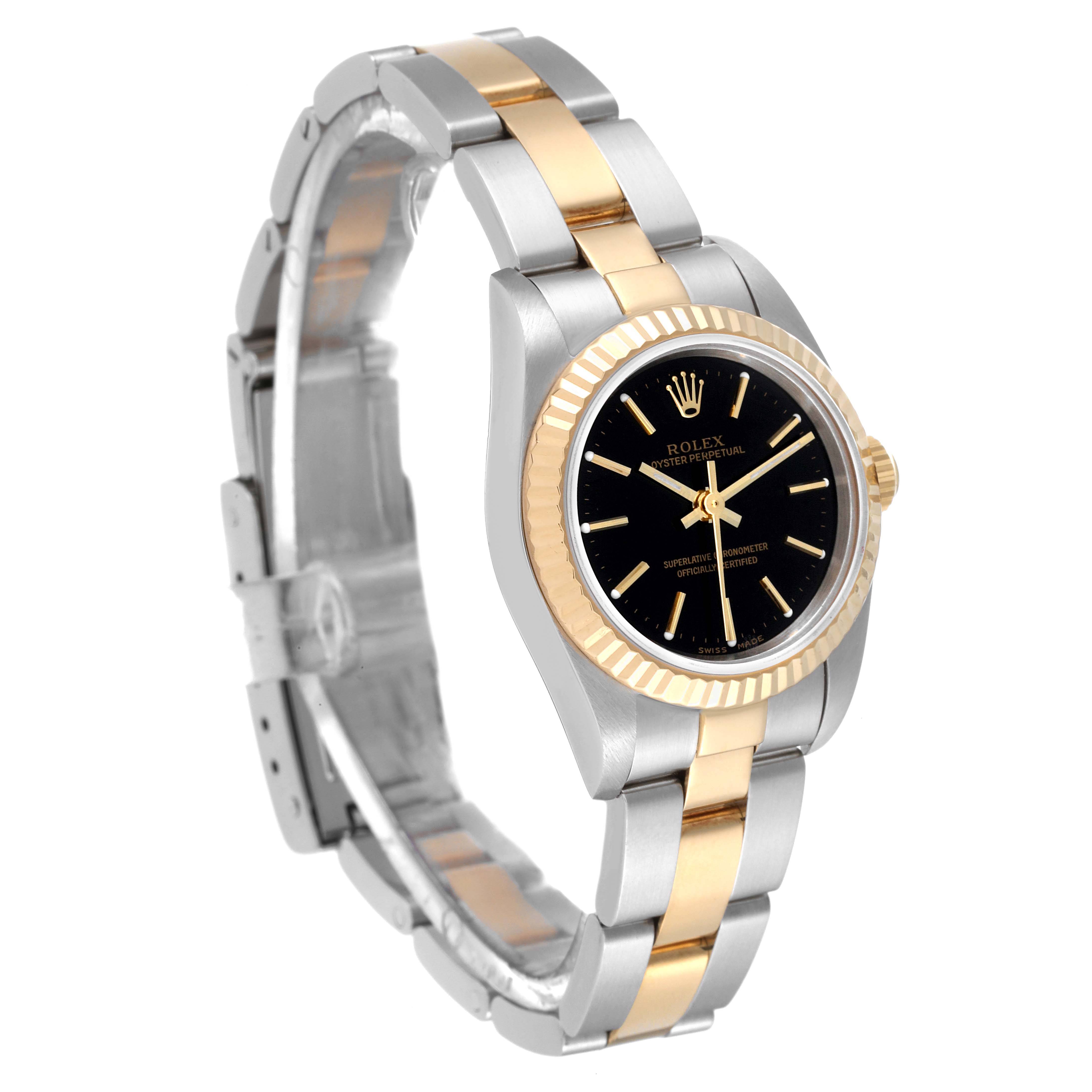 The image shows a Rolex Oyster Perpetual 76193 Women's Steel and Gold (two tone) Black Dial 76193 Women's Steel and Gold (two tone) Black Dial watch at a three-quarter angle, displaying the face, bezel, and bracelet.