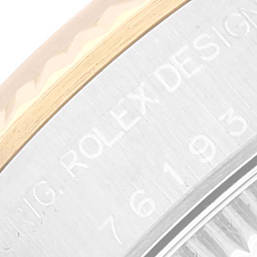 This image shows a close-up of the side of a Rolex Oyster Perpetual 76193 Women's Steel and Gold (two tone) Black Dial 76193 Women's Steel and Gold (two tone) Black Dial watch case, featuring the engraved brand name.