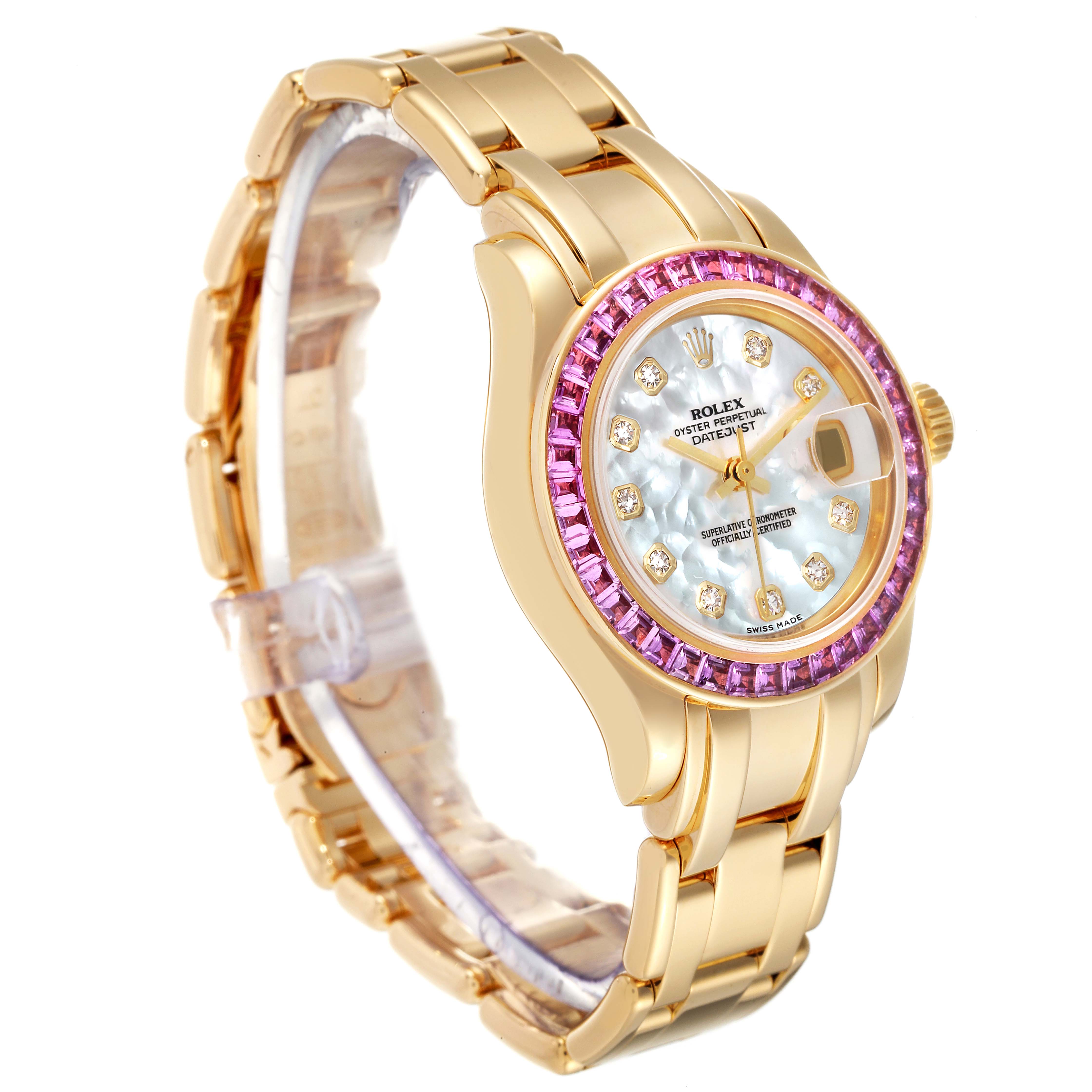 The Rolex Pearlmaster 80308 Women's Yellow Gold Mother of Pearl Dial 80308 Women's Yellow Gold Mother of Pearl Dial watch is displayed at a three-quarter angle, showcasing its gold bracelet, diamond markers, and pink gemstone bezel.